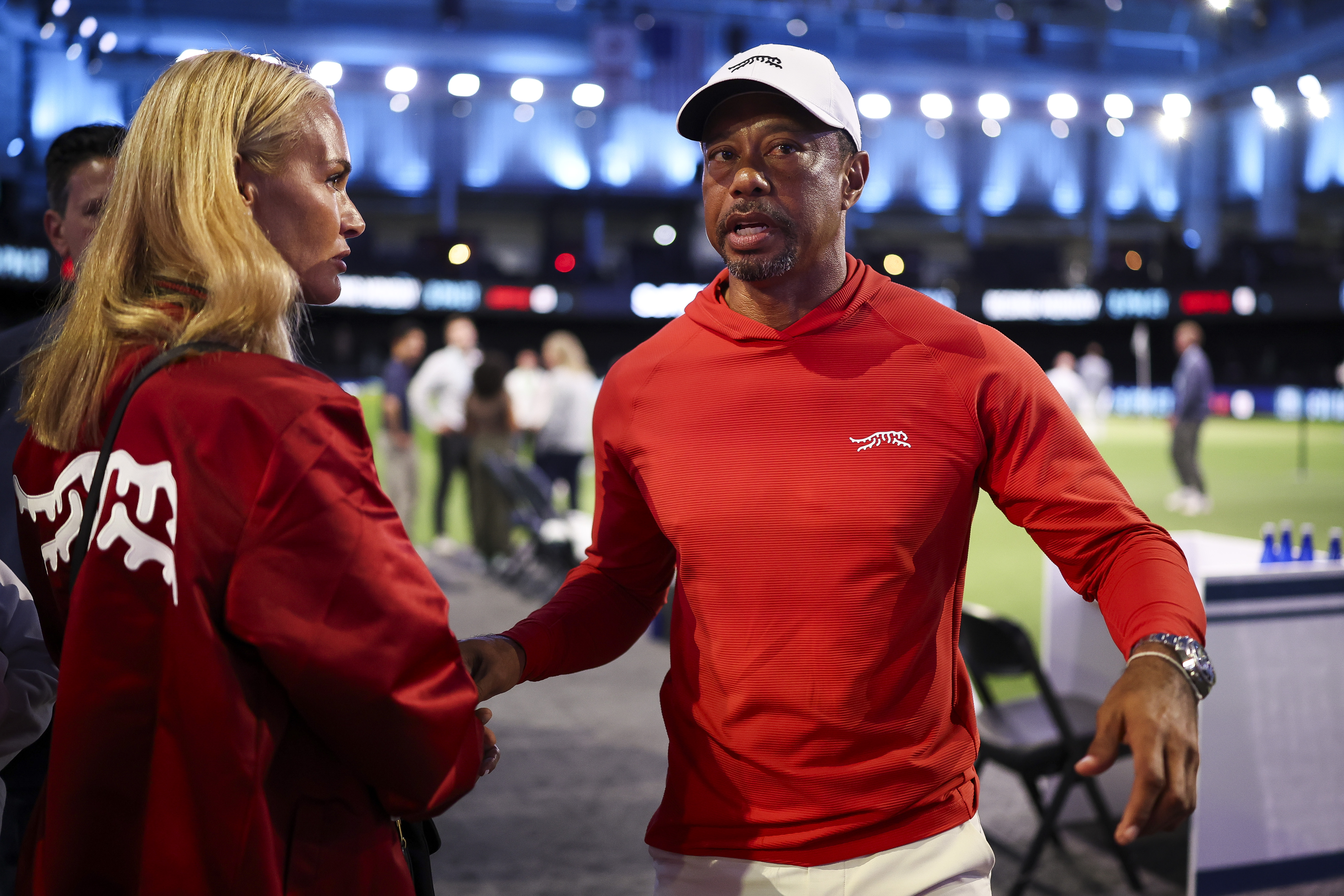 Tiger Woods of Jupiter Links GC talks with his girlfriend, Vanessa Trump, after a match against Boston Common Golf at SoFi Center on March 17, 2026 in Palm Beach Gardens, Florida. | Source: Getty Images