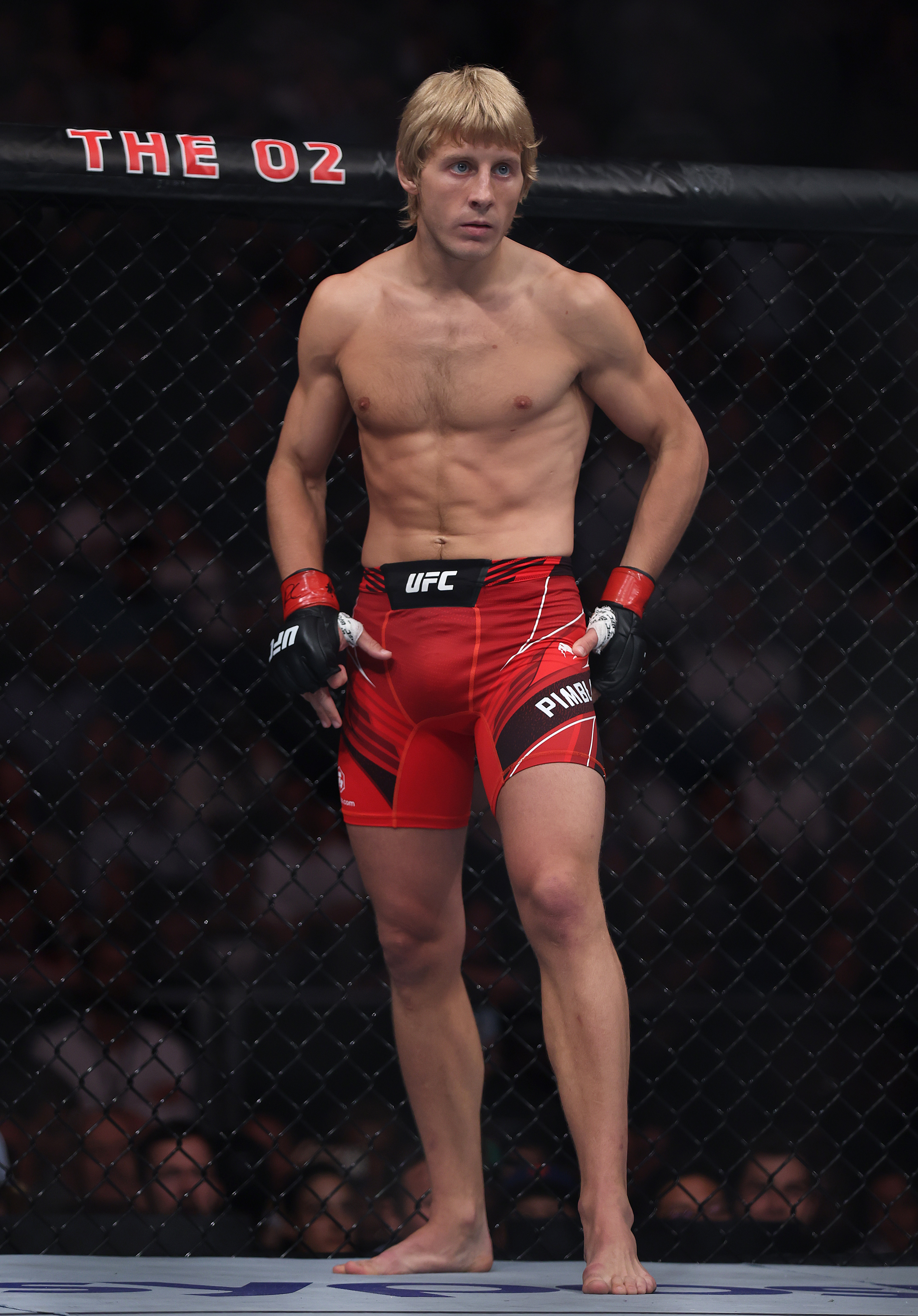 Paddy Pimblett waited inside the Octagon before facing Jordan Leavitt in their lightweight bout at UFC Fight Night at the O2 Arena in London, England, on July 23, 2022. Having made the 155-pound limit the previous day, "The Baddy" entered the contest seeking his third consecutive UFC victory and another finish to continue his unbeaten start with the promotion.