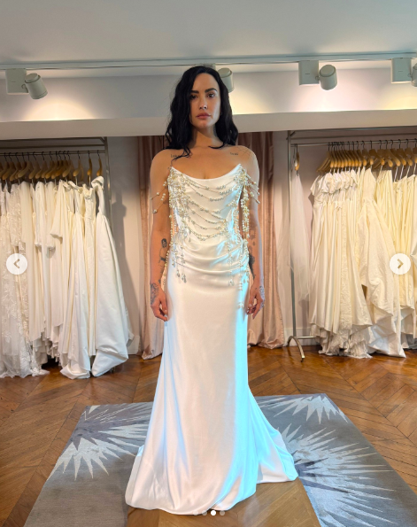 Demi Lovato posing in another wedding dress embellished with pearls. | Source: Instagram/voguemagazine
