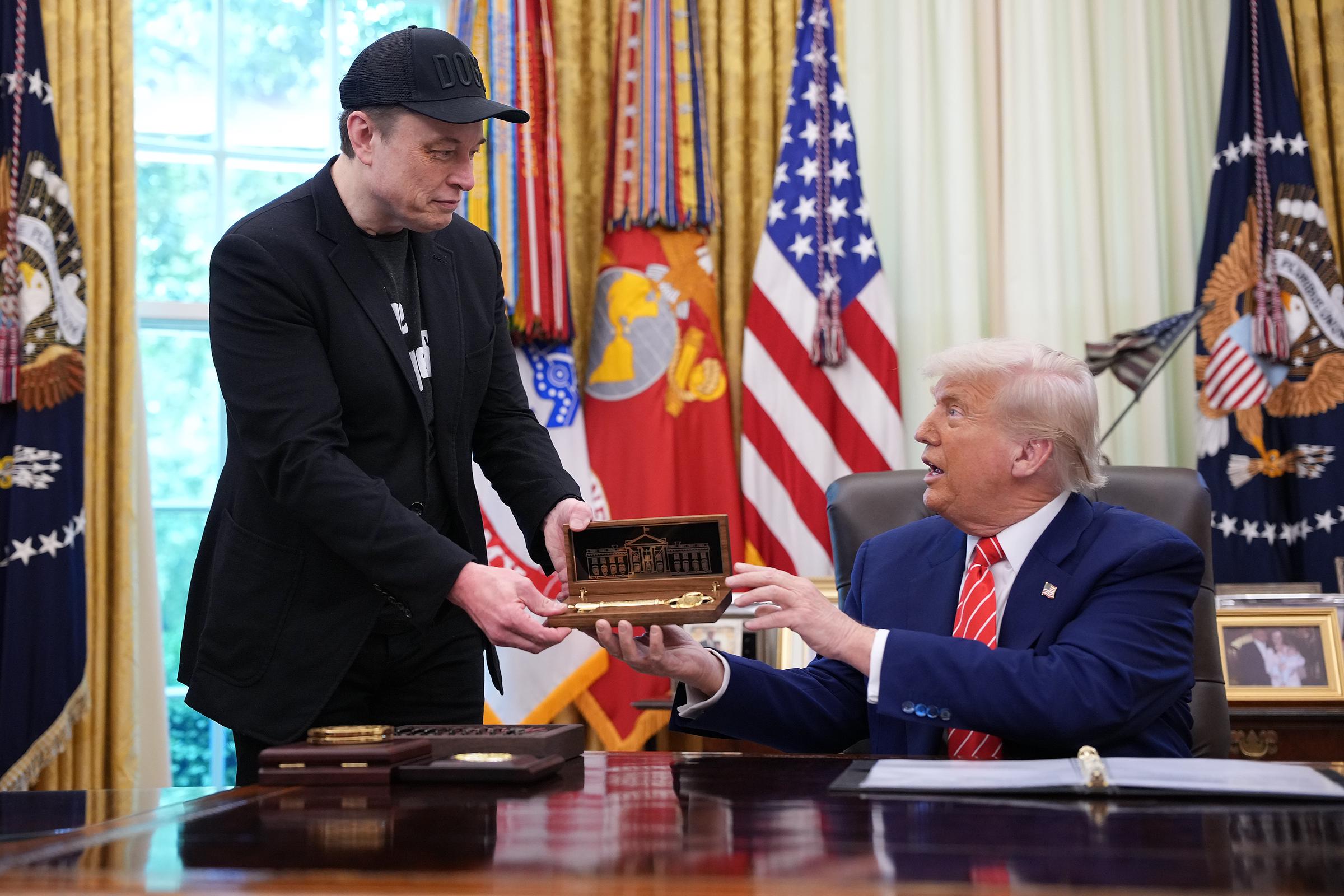 Elon Musk receiving a key from President Donald Trump at the Oval Office of the White House in Washington D.C on May 30, 2025 | Source: Getty Images