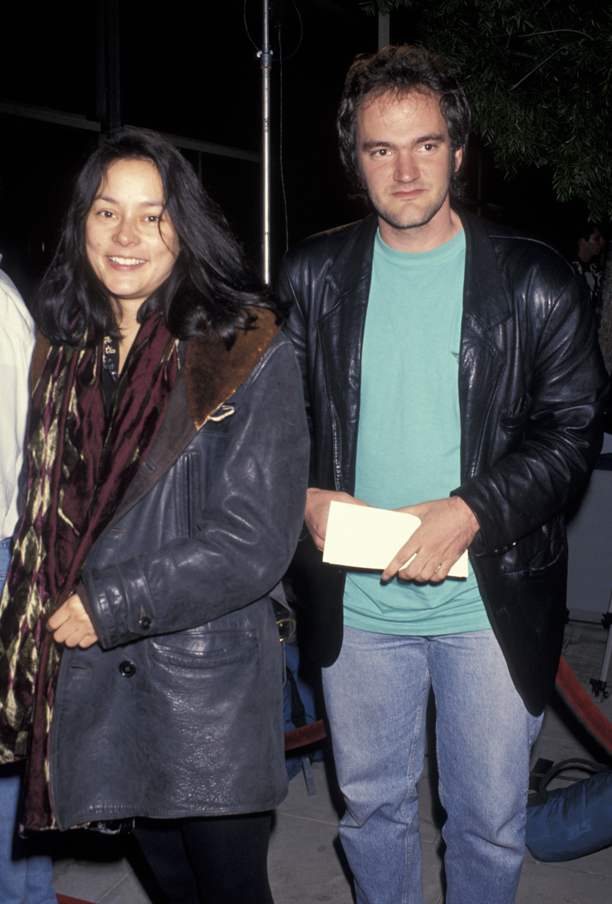 Actors Meg Tilly and Quentin Tarantino attend the Beverly Hills premiere of "Tristar's Threesomes" on April 8, 1994 | Source: Getty Images