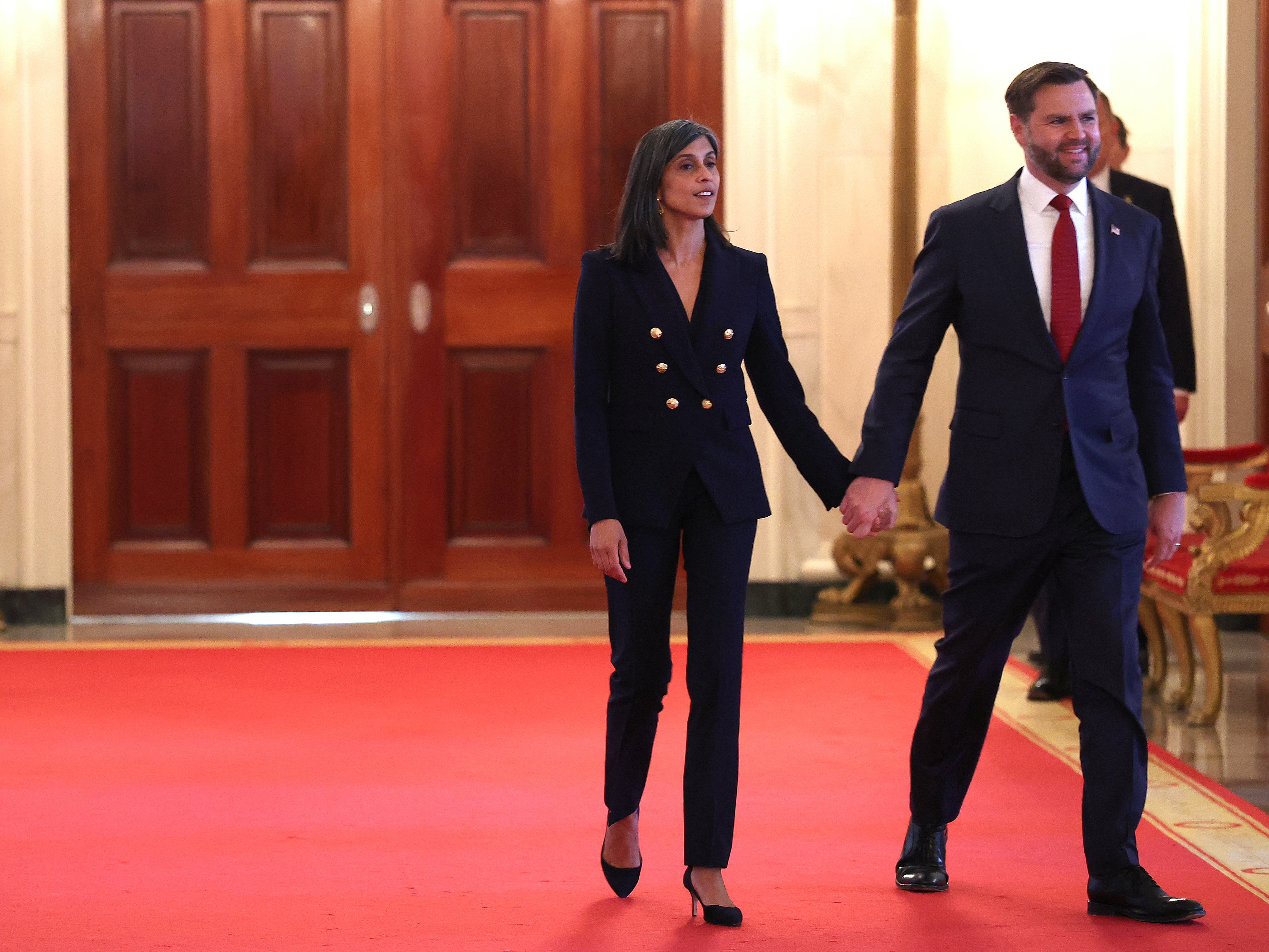 JD Vance and Usha arrive for the signing ceremony for the "Fostering the Future" executive order in the East Room at the White House in Washington, DC on November 13, 2025. | Source: Getty Images