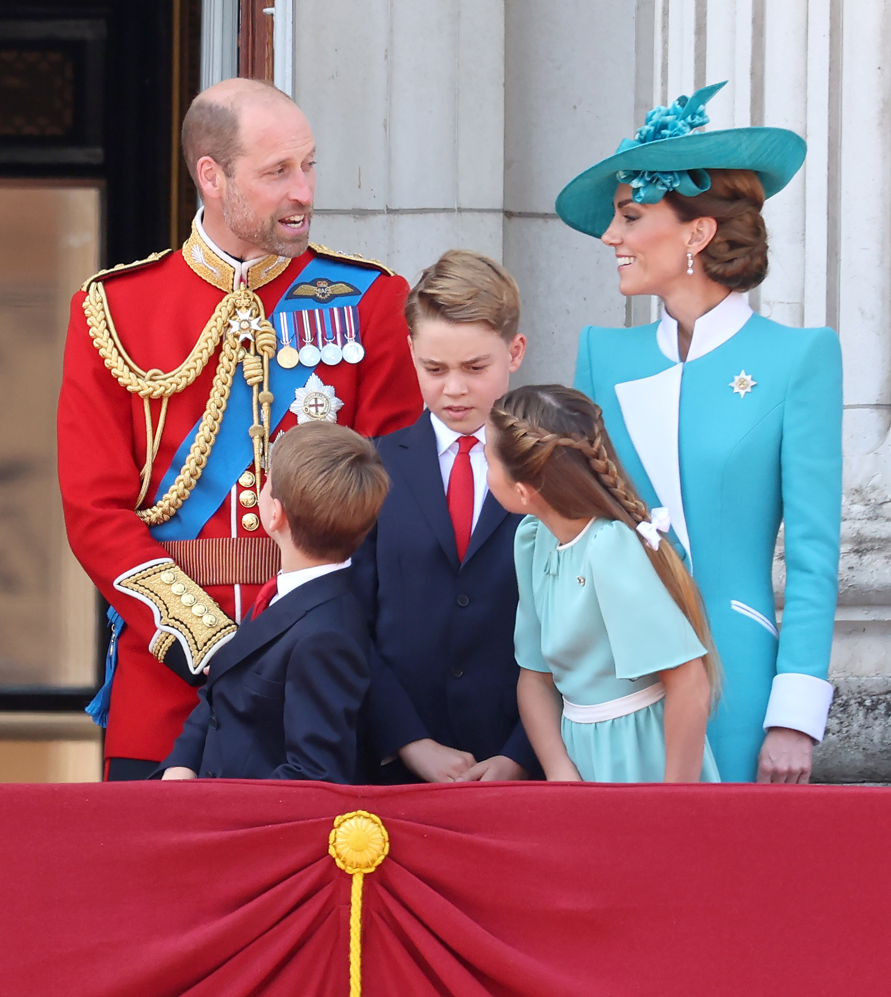 Princess Charlotte and her family interact on the balcony of Buckingham Palace during Trooping The Colour 2025 in London, England.