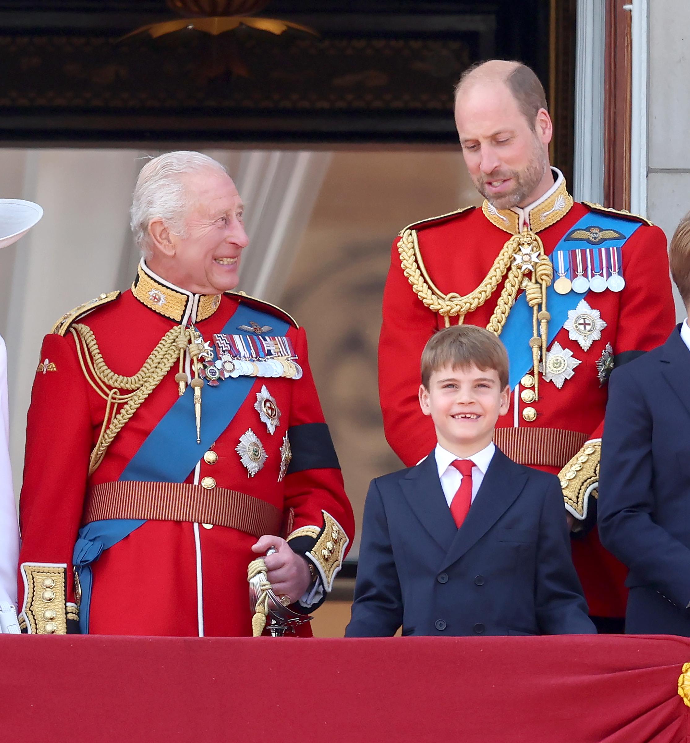 King Charles III and Prince William exchanging words as Prince Louis smiles at the crowd. | Source: Getty Images