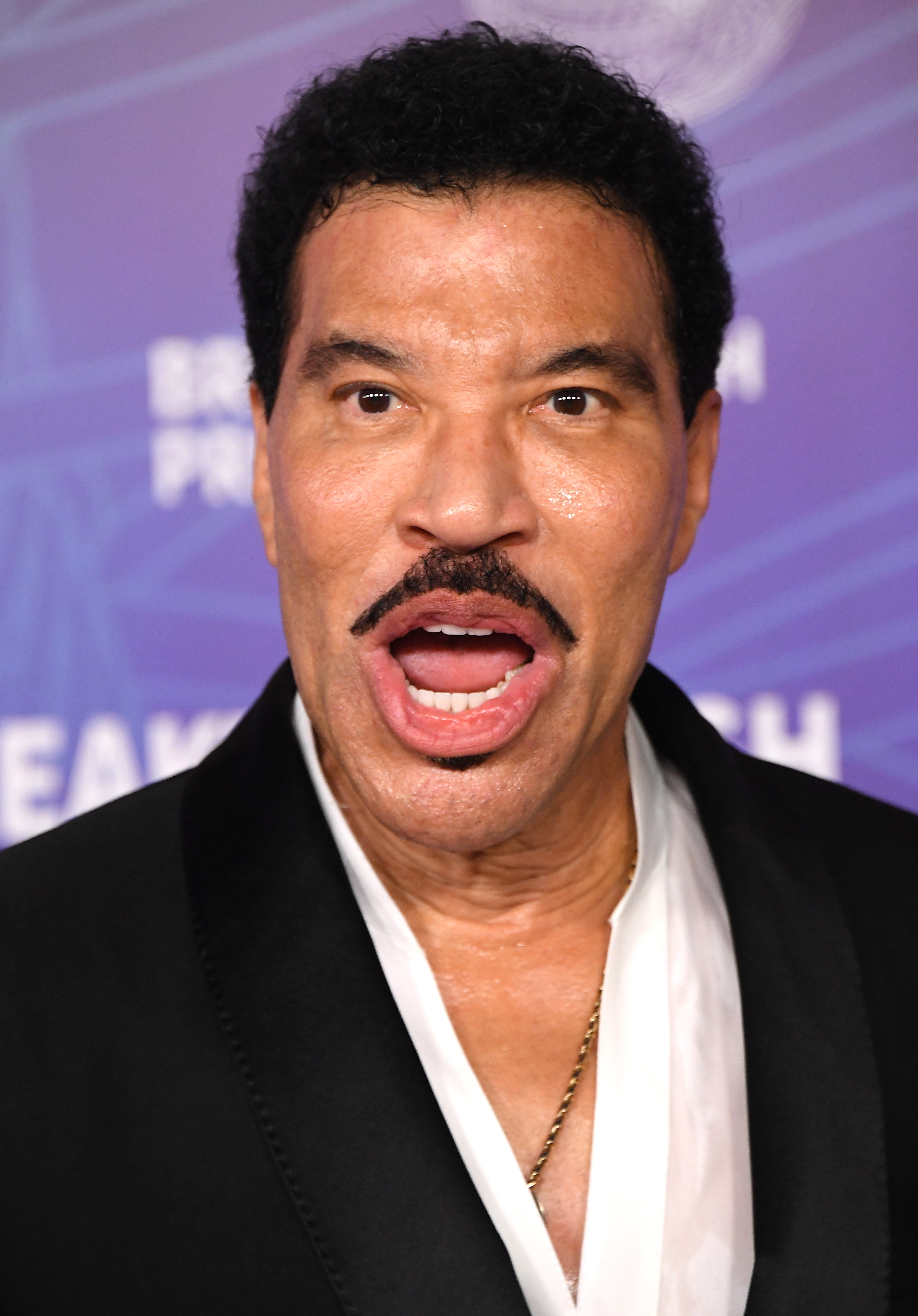 Months before his St. Louis performance ended with Richie sitting through part of his closing number, the singer remained active onstage and at public events. This April 2026 appearance at the Breakthrough Prize Ceremony captured him during the same year that brought two separate concert health scares. | Source: Getty Images