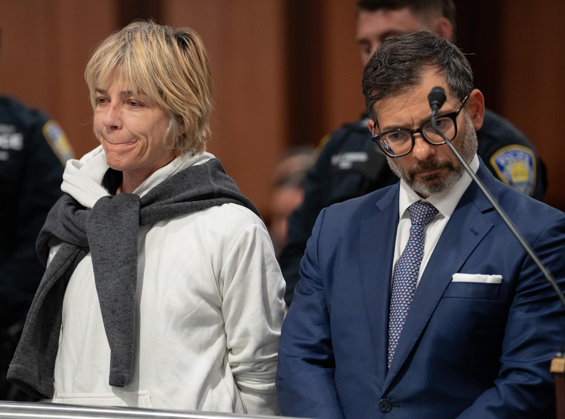 Selma Blair appears inside Queens Criminal Court on October 12, 2026, alongside a man in a blue suit. Judge Indira Khan set bail at $20,000 in cash or by credit card, with an alternative $60,000 bond, after Blair pleaded not guilty to the charges. | Source: Getty Images