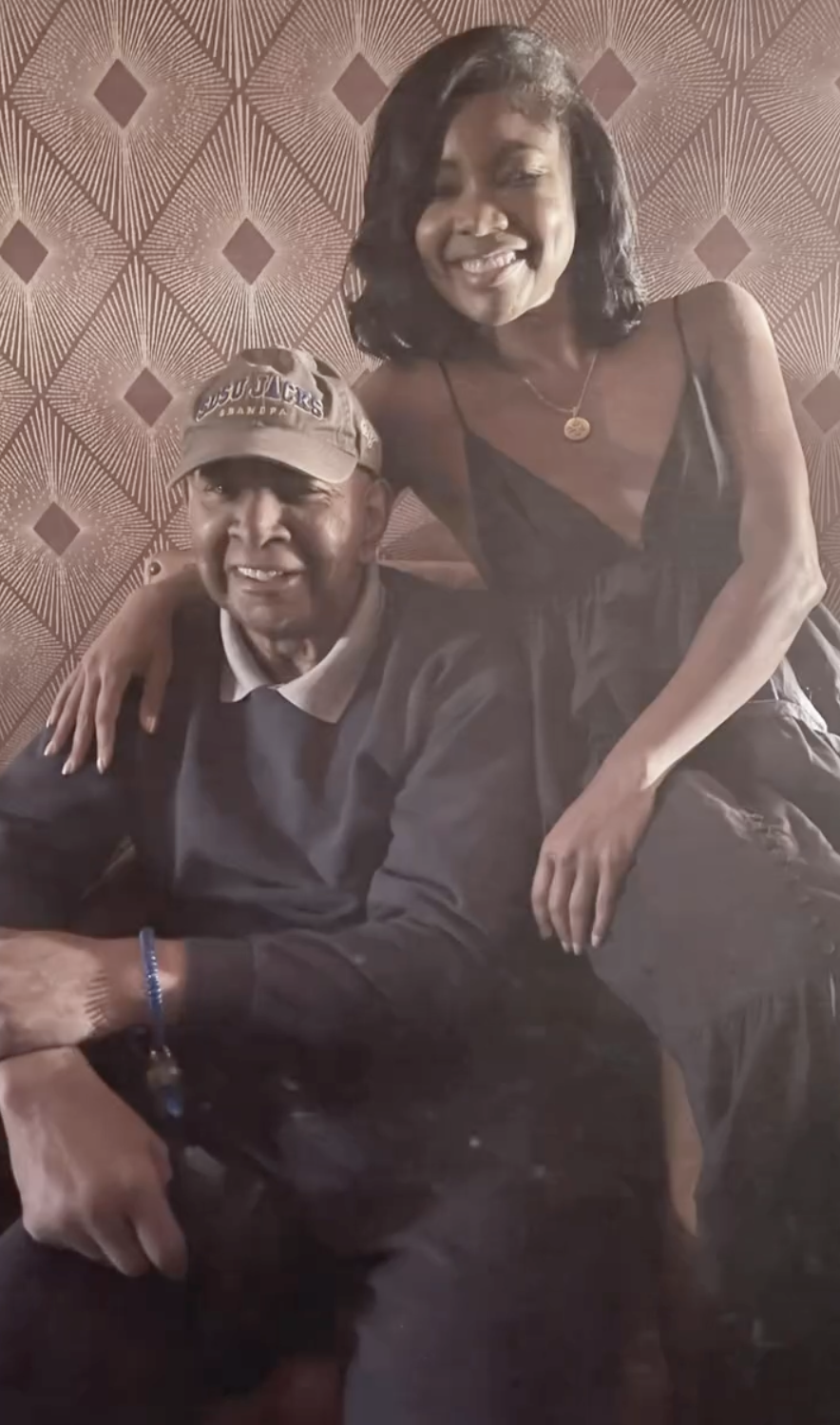 An intimate portrait of Gabrielle Union with her father, Sylvester Union. Gabrielle, dressed in a black outfit, leans affectionately on him while smiling at the camera. | Source: Instagram/gabunion