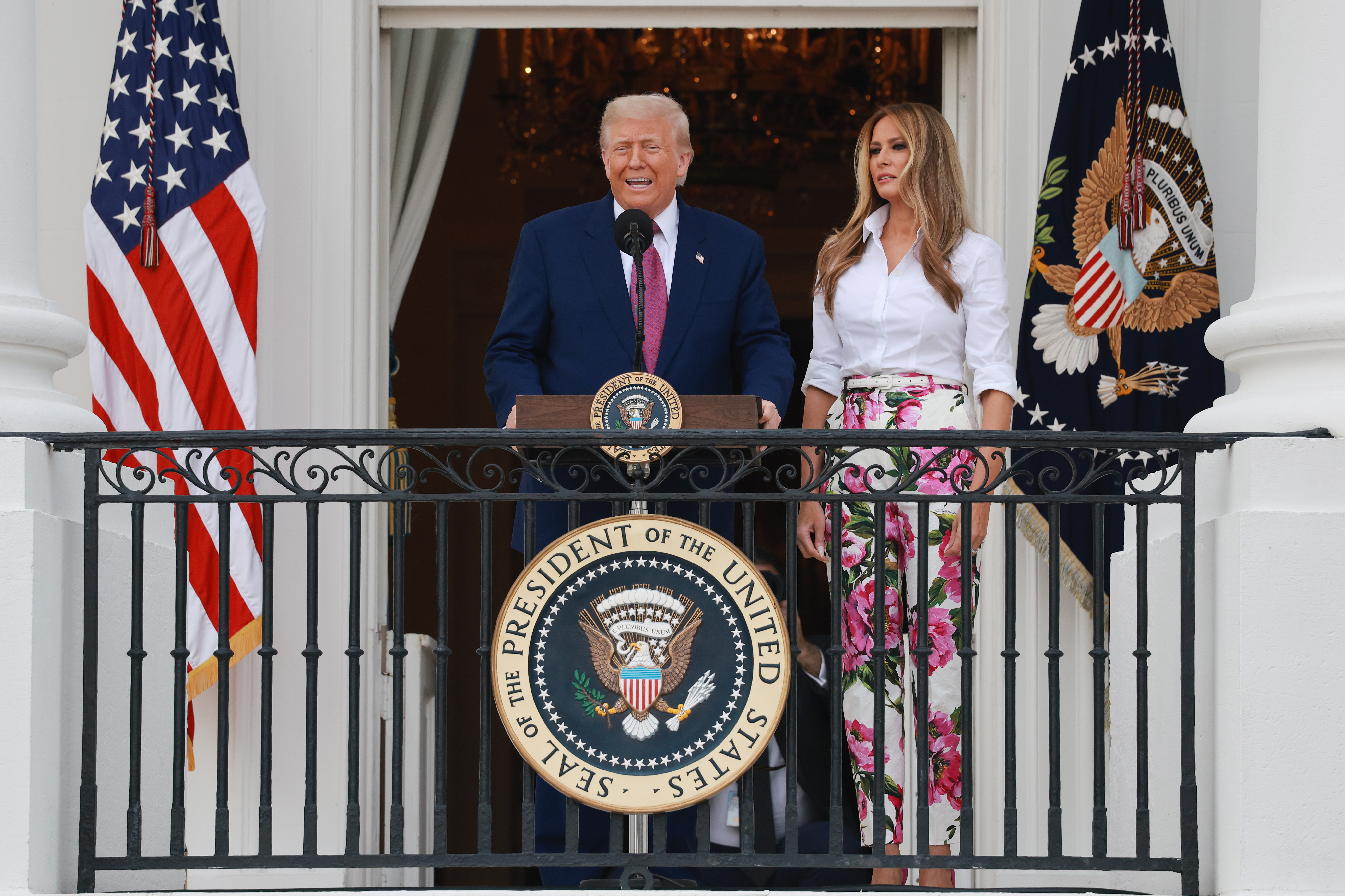 Donald Trump addresses members of Congress alongside Melania Trump, during the Congressional Picnic on the South Lawn of the White House on June 12, 2025 in Washington, DC | Source: Getty Images