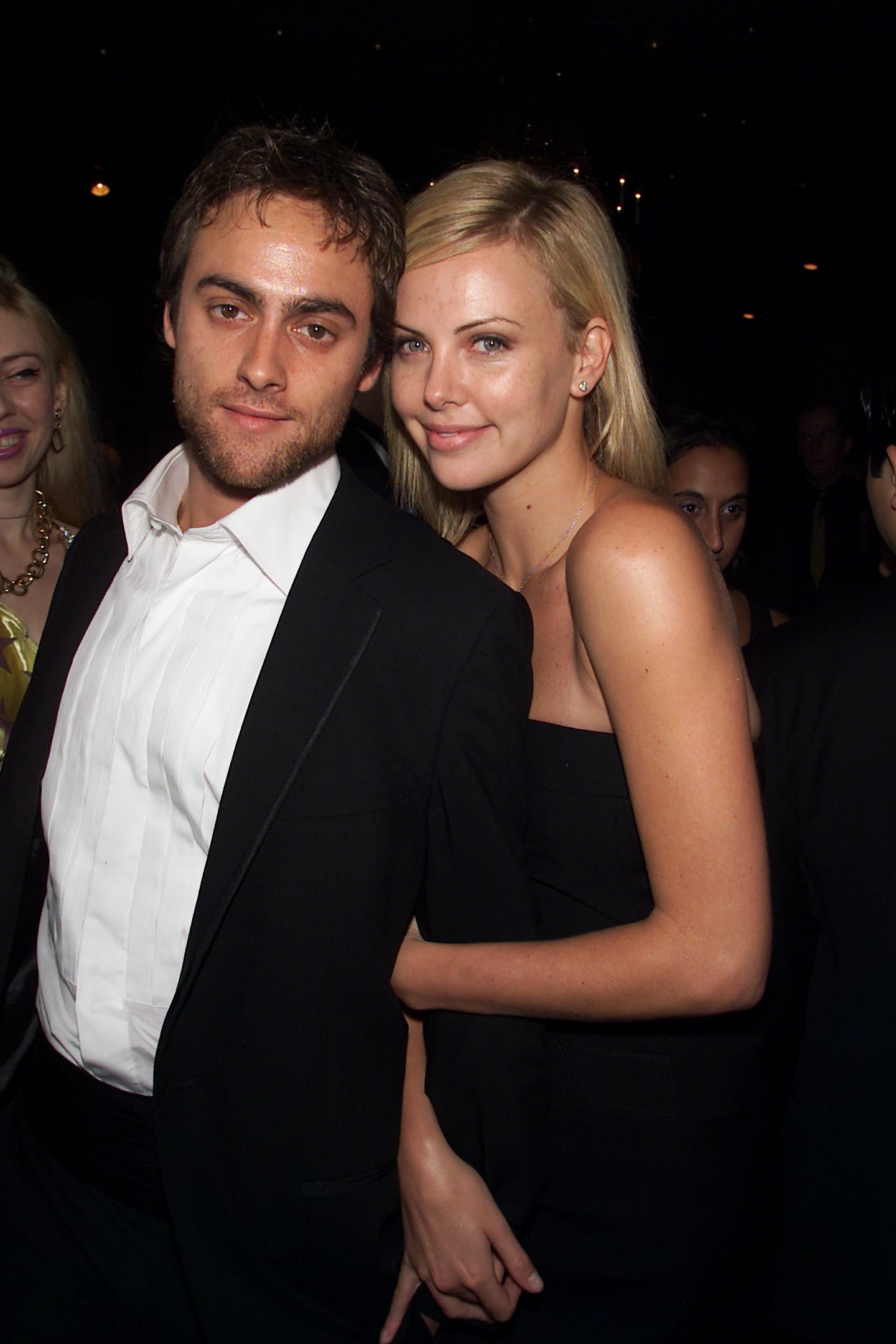 Stuart Townsend and Charlize Theron stayed close while attending PETA's 21st Anniversary Party and Humanitarian Awards at the Waldorf Astoria Hotel in New York City on September 8, 2001. Dressed in coordinating black eveningwear, the couple faced photographers together at the event, showing Townsend in another public appearance after his planned turn as Aragorn ended and his acting career continued along a different path.