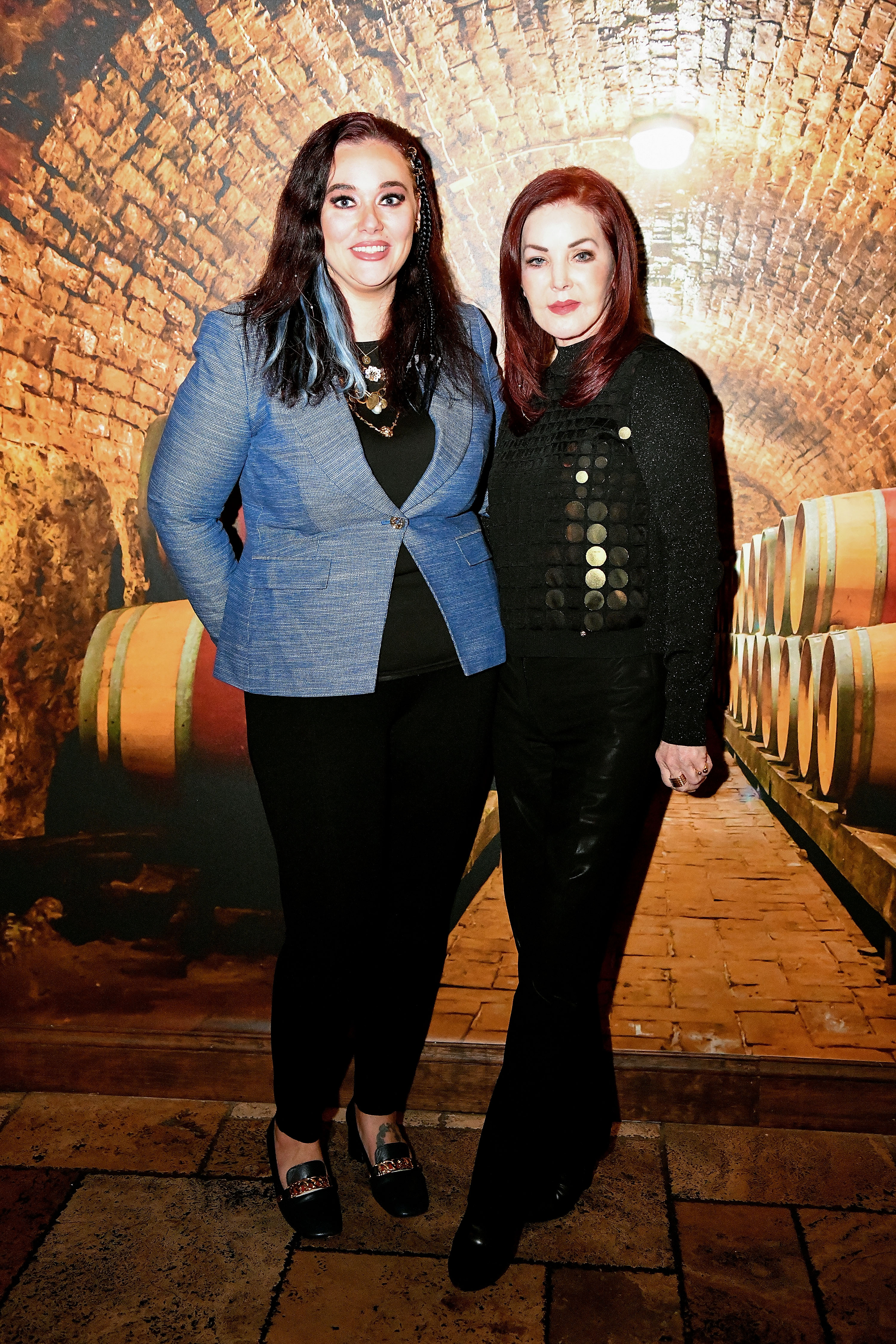 Brigitte Kruse and Priscilla Presley pose during the Vineyard Wine Bar Bistro Presents Priscilla Presley in Orlando, Florida on January 5, 2023. | Source: Getty Images
