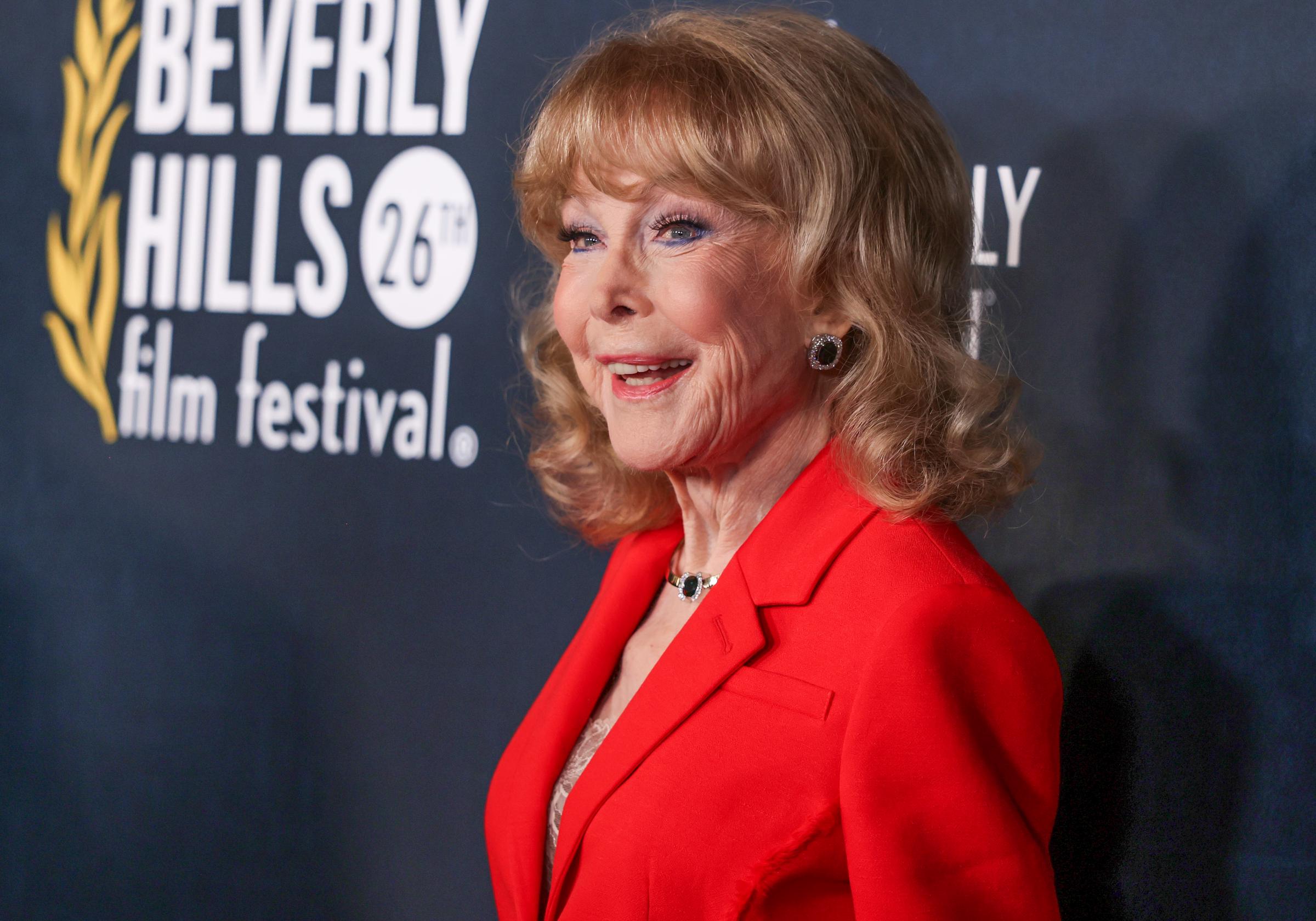 Eden struck a playful pose during her April appearance at the Beverly Hills Film Festival, one of several public outings she made in the months before Cinecon. The actress would turn 95 in August and was still discussing the possibility of taking on another acting role. | Source: Getty Images