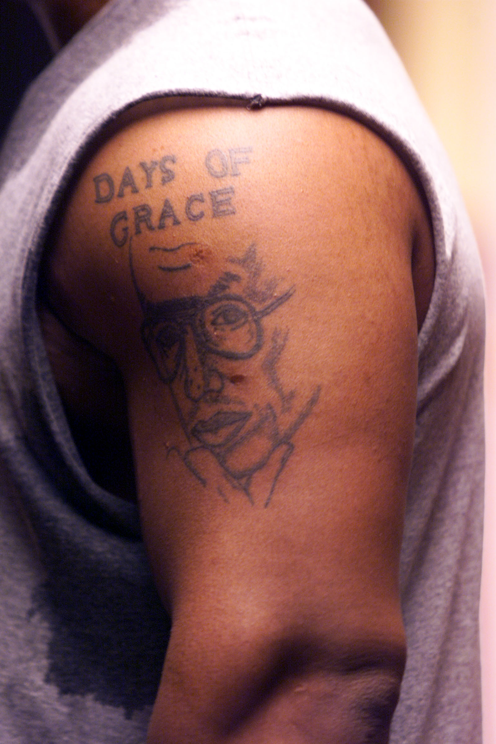 A close-up of Mike Tyson's tattoo of Arthur Ashe. | Source: Getty Images