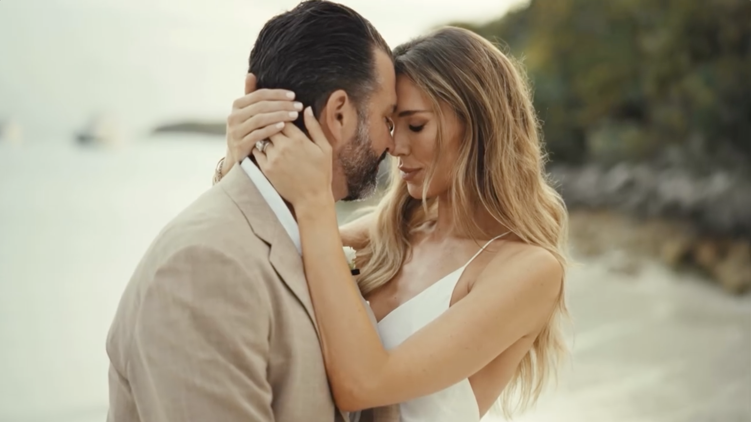 Donald Trump Jr. and Bettina Anderson lean in forehead to forehead during a beachside portrait following their wedding ceremony. | Source: Instagram/donaldjtrumpjr