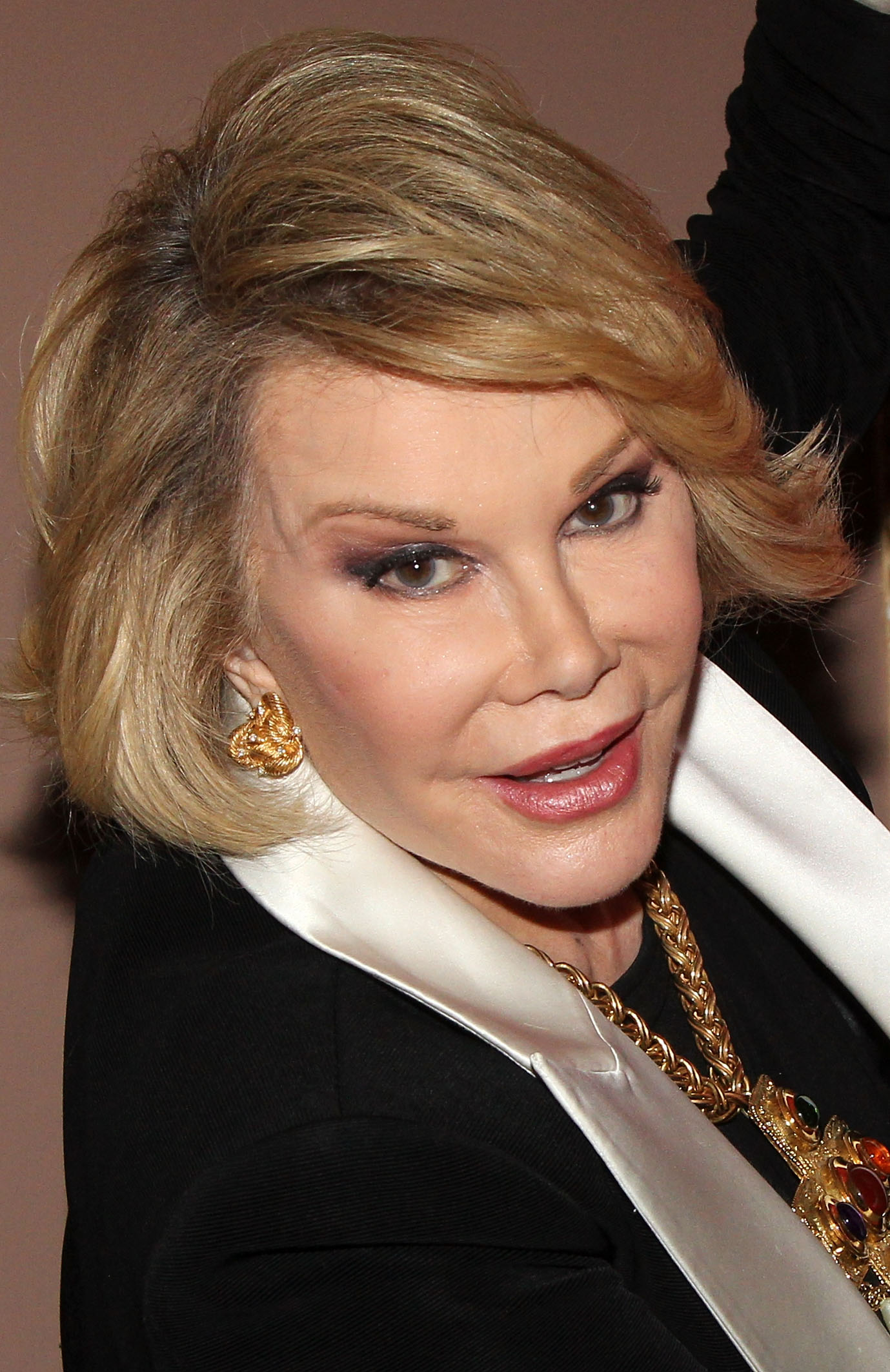 Joan Rivers poses backstage at the Broadway musical "Rocky" at the Winter Garden Theatre in New York City on July 11, 2014. | Source: Getty Images