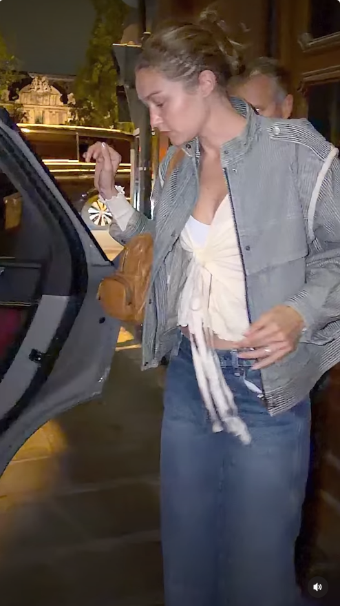 Gigi Hadid steps out in Paris after the couple’s latest outing, wearing a striped jacket over a white top and blue jeans as fans continued to debate her relationship with Bradley Cooper and the meaning behind their rings. | Source: Instagram/thehollywoodpipeline