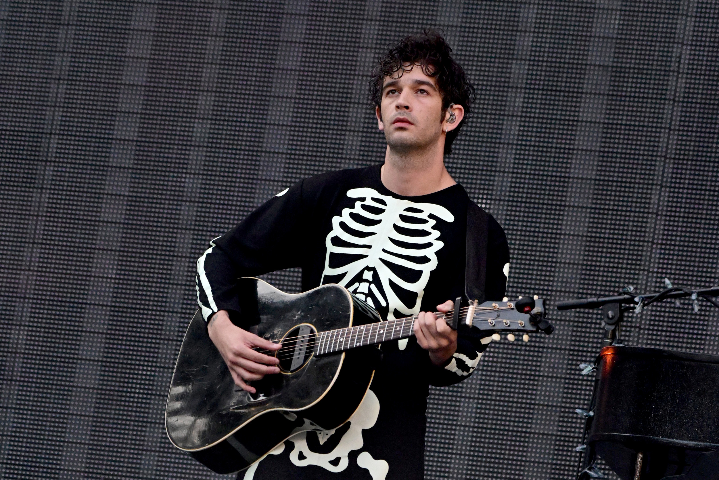 Matty Healy onstage during the Phoebe Bridgers opening set for Taylor Swift's "The Eras Tour" on May 12, 2023 in Philadelphia, Pennsylvania. | Source: Getty Images