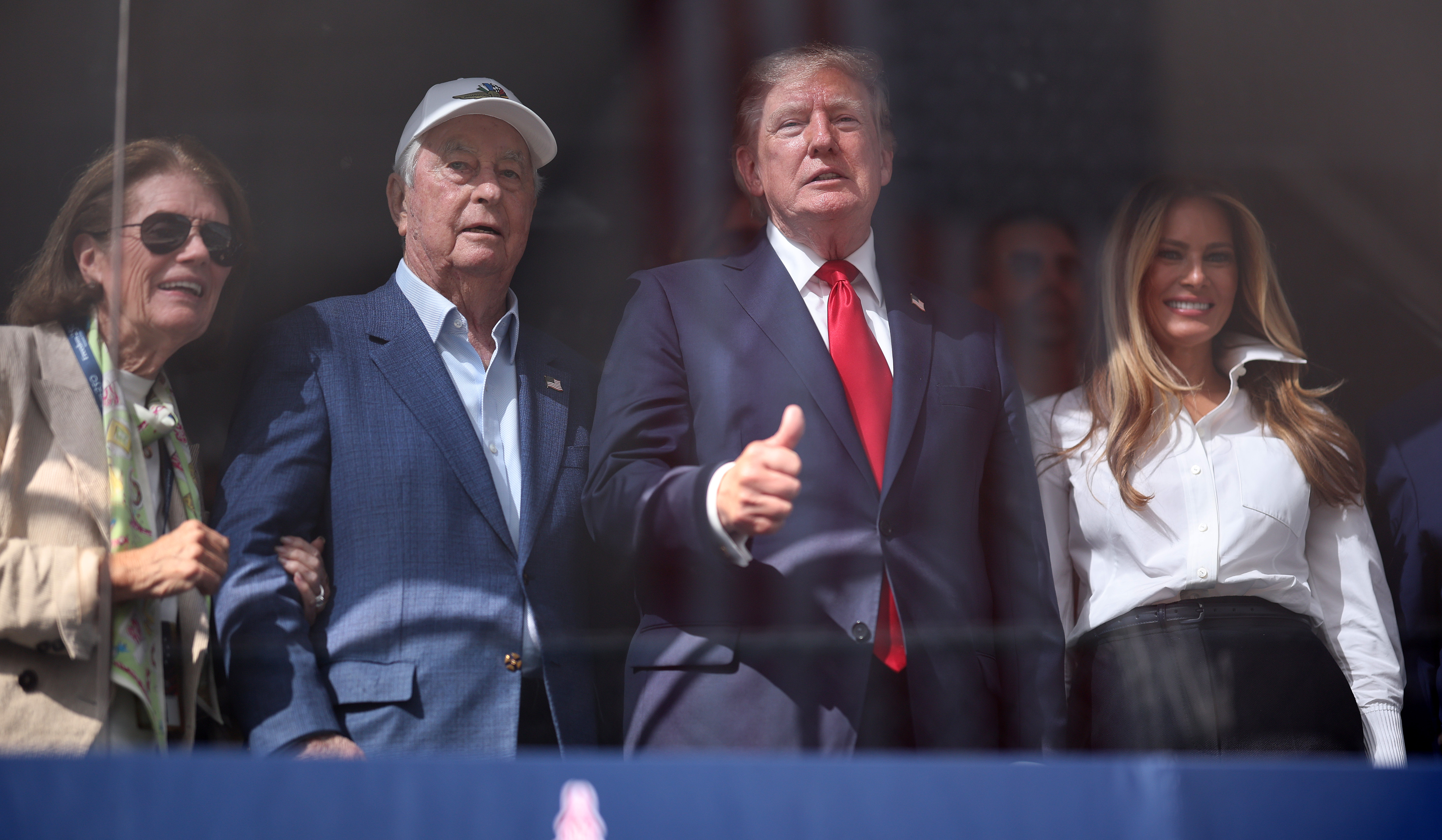 Donald Trump and Melania Trump joined Roger Penske during the NTT INDYCAR Series Freedom 250 on August 23, 2026, in Washington, D.C. | Source: Getty Images