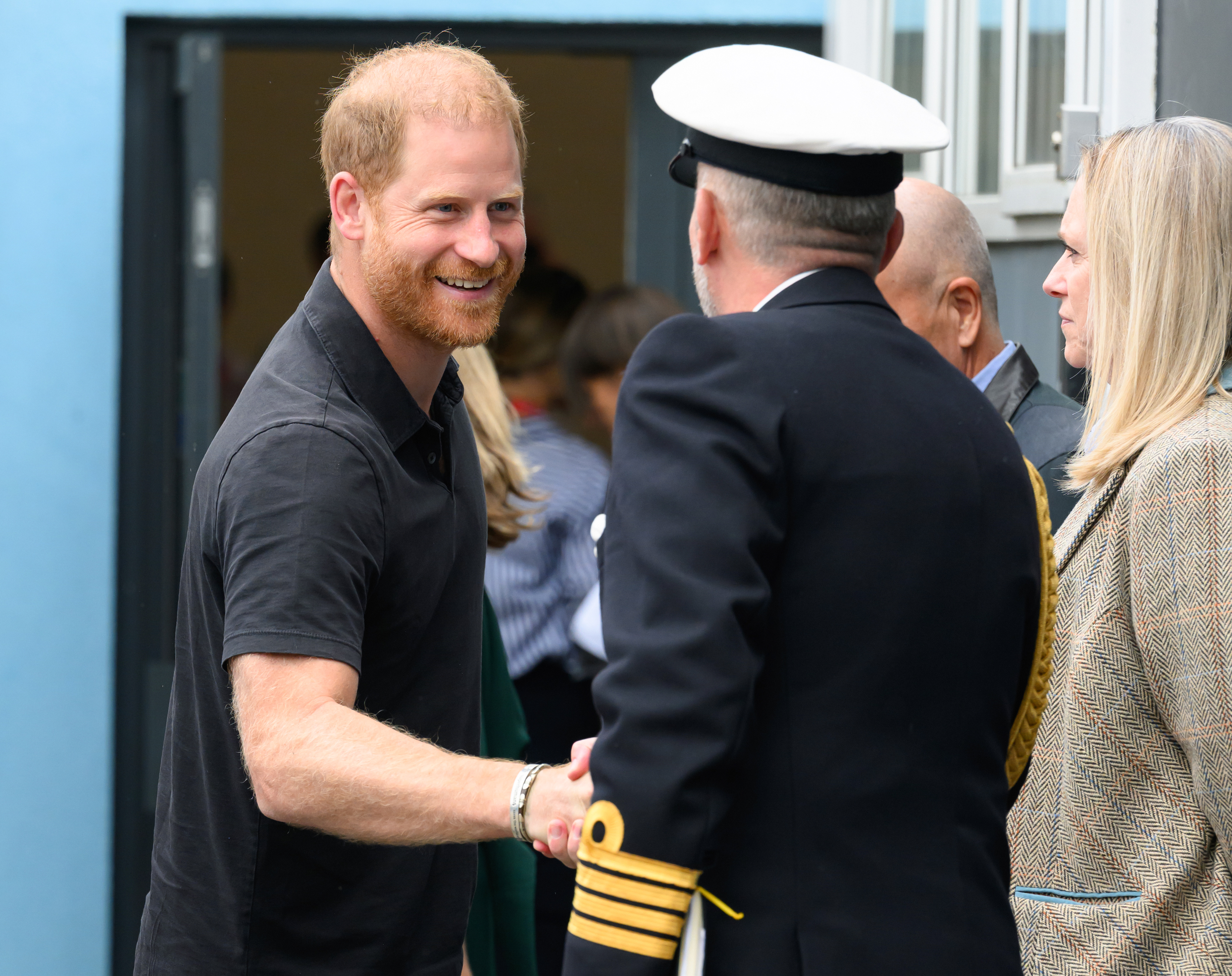 The Duke greets a uniformed official with a warm smile and handshake during the launch of the Invictus Games-inspired INSPIRE Education Programme. | Source: Getty Images