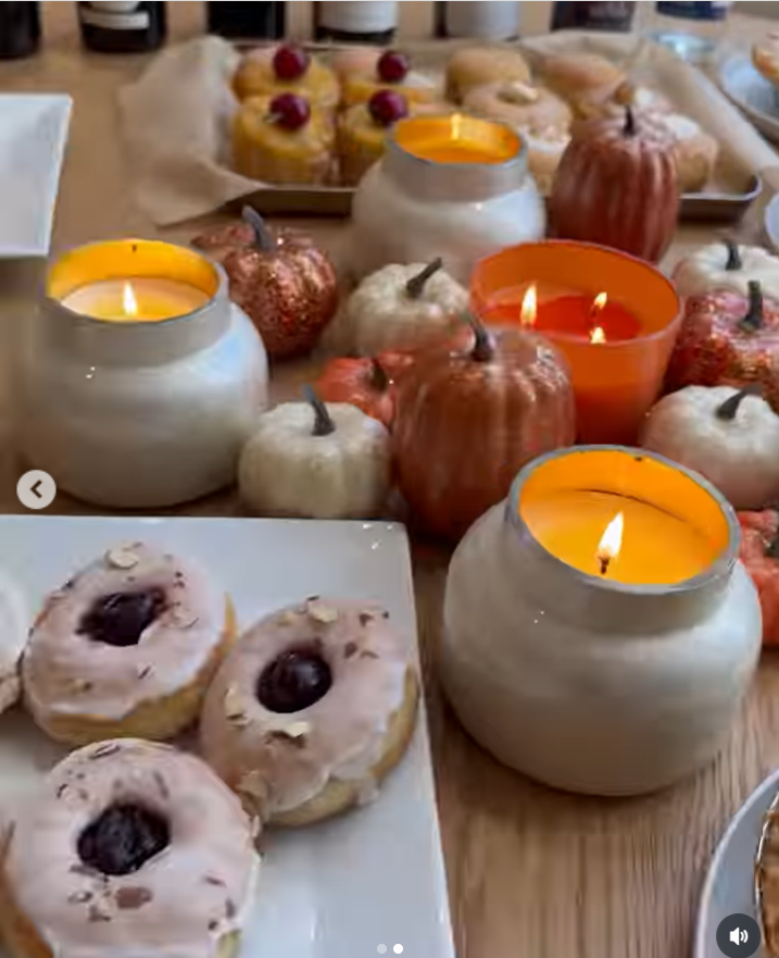 The table displaying plates of donuts topped with pale icing and a dark cherry-like center, as seen from Ciara Wilson's post dated November 28, 2025. | Source: Instagram/ciara