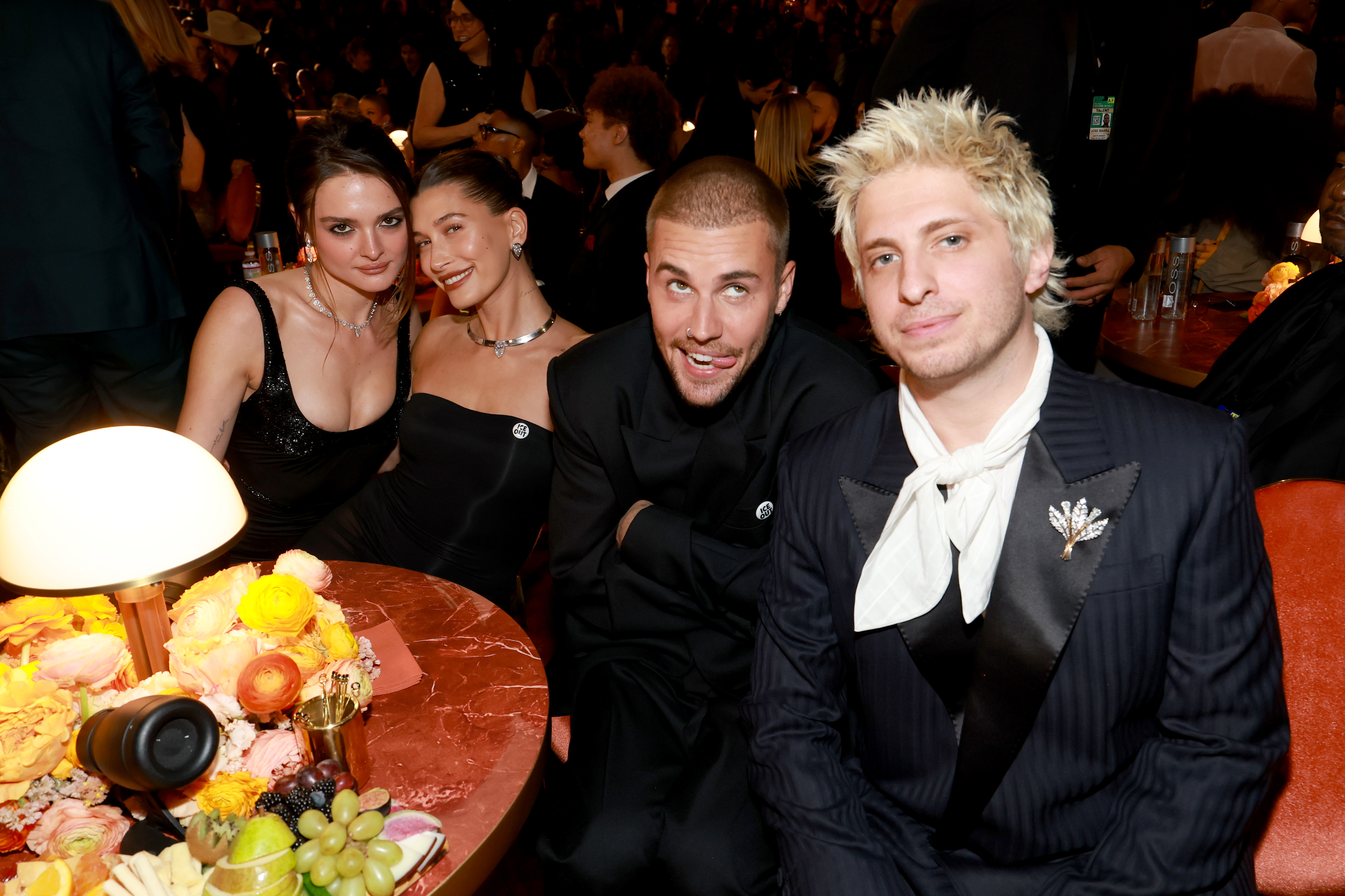 Justin and Hailey Bieber pose with Charlotte Lawrence and Andrew Watt inside the Grammys.