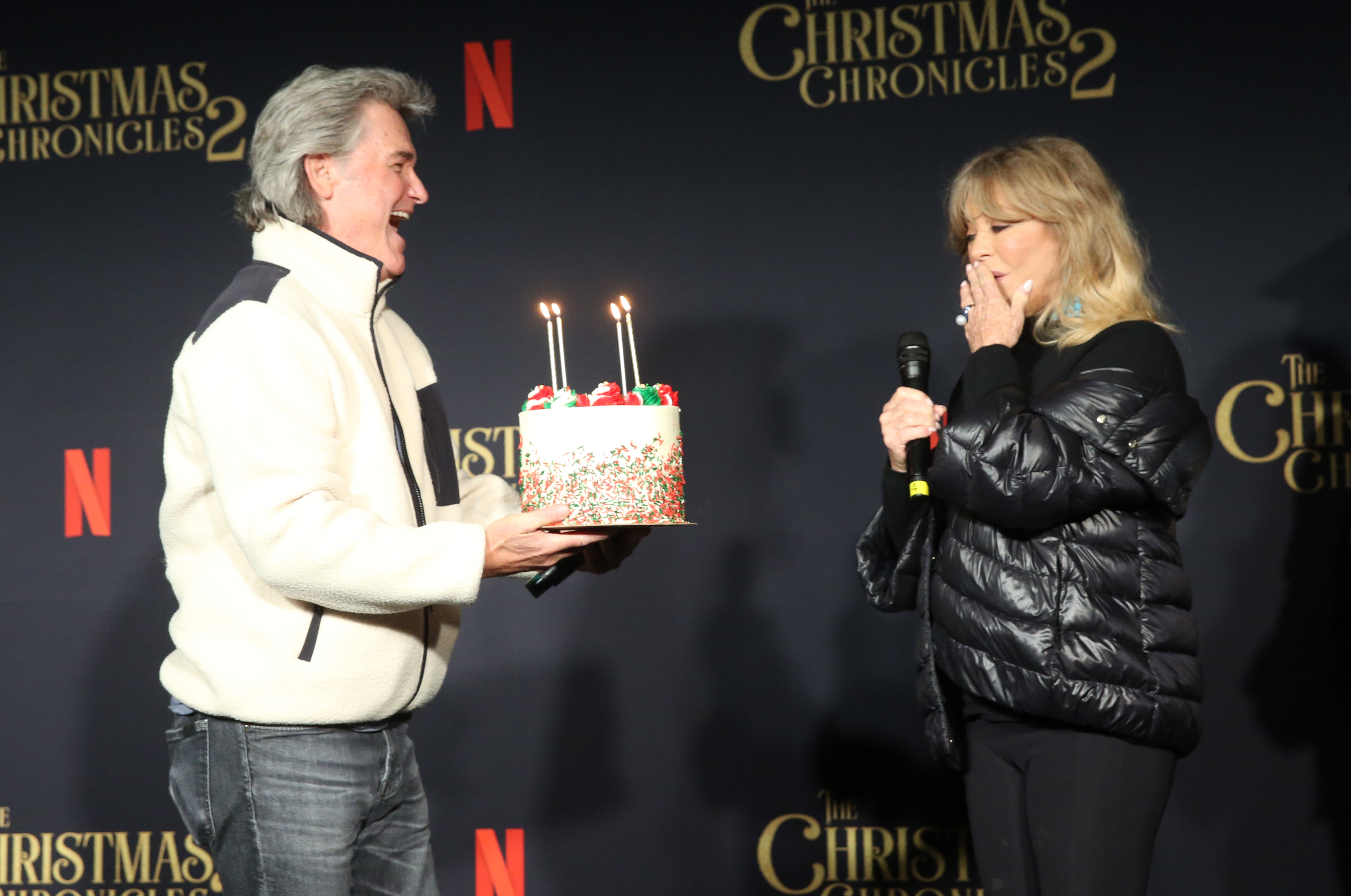 Kurt Russell surprised Goldie Hawn with a birthday cake during a The Christmas Chronicles 2 event. The longtime couple have shared both their personal lives and the screen for decades. | Source: Getty Images.