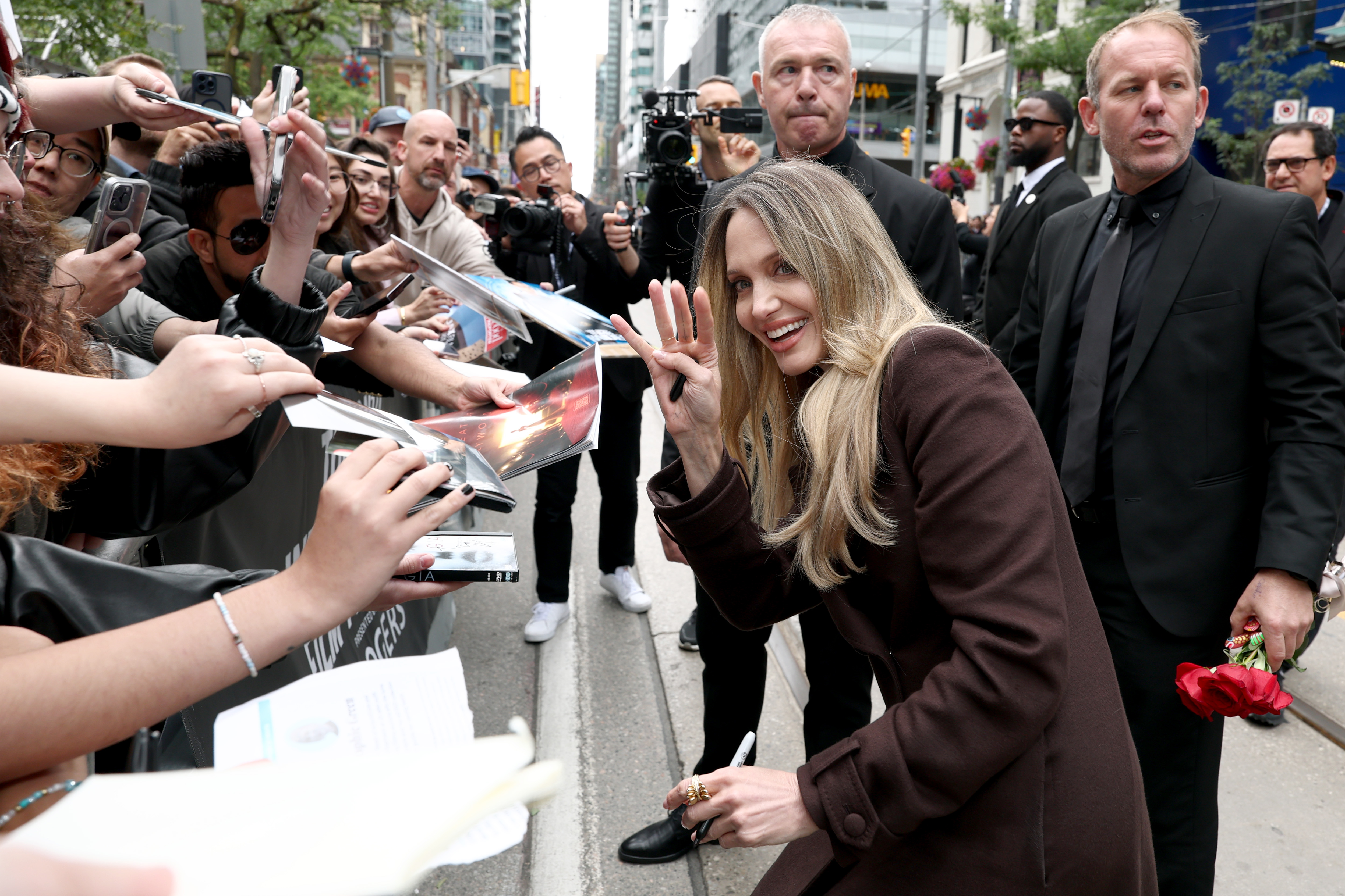 Angelina Jolie interacts with the fans at the premiere of "Couture" during the 2025 Toronto International Film Festival at Princess of Wales Theater in Ontario on September 7 | Source: Getty Images