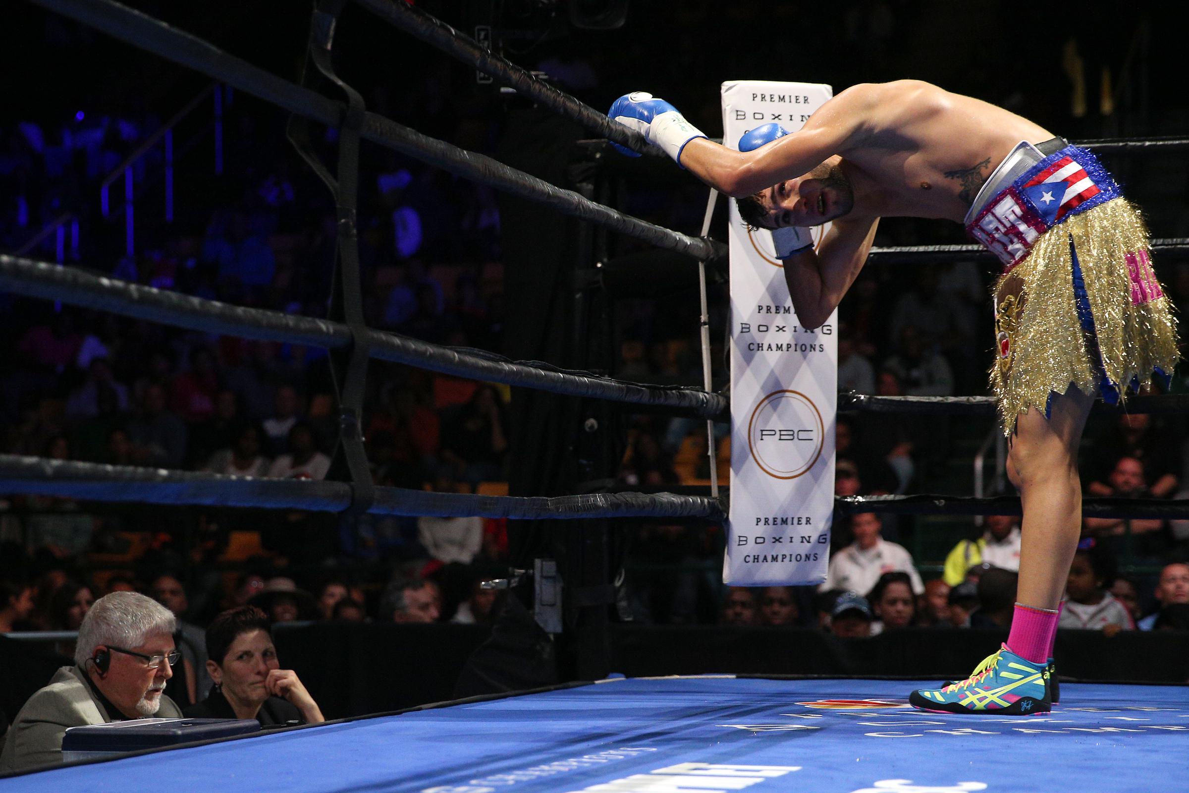 Prichard holds the back of his head after taking a punch from Terrel during the bout. His family later alleged that he reported pain and dizziness during the fight and that the ringside doctor failed to act. | Source: Getty Images