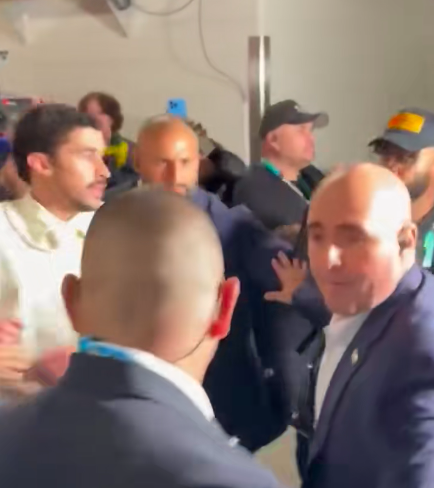 Bad Bunny scans the room as heavy security presence surrounds him. | Source: TikTok/@entertainmenttonight