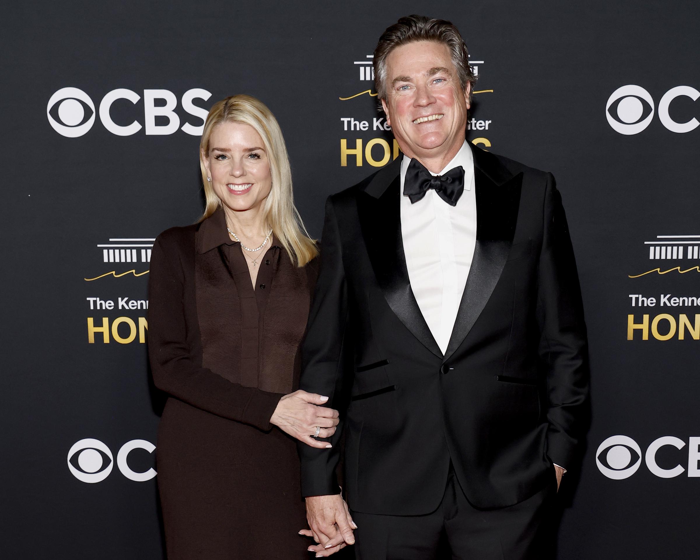 Pam Bondi and John Wakefield pose on the red carpet at the Kennedy Center Honors in Washington, D.C., on December 7, 2025 | Source: Getty Images