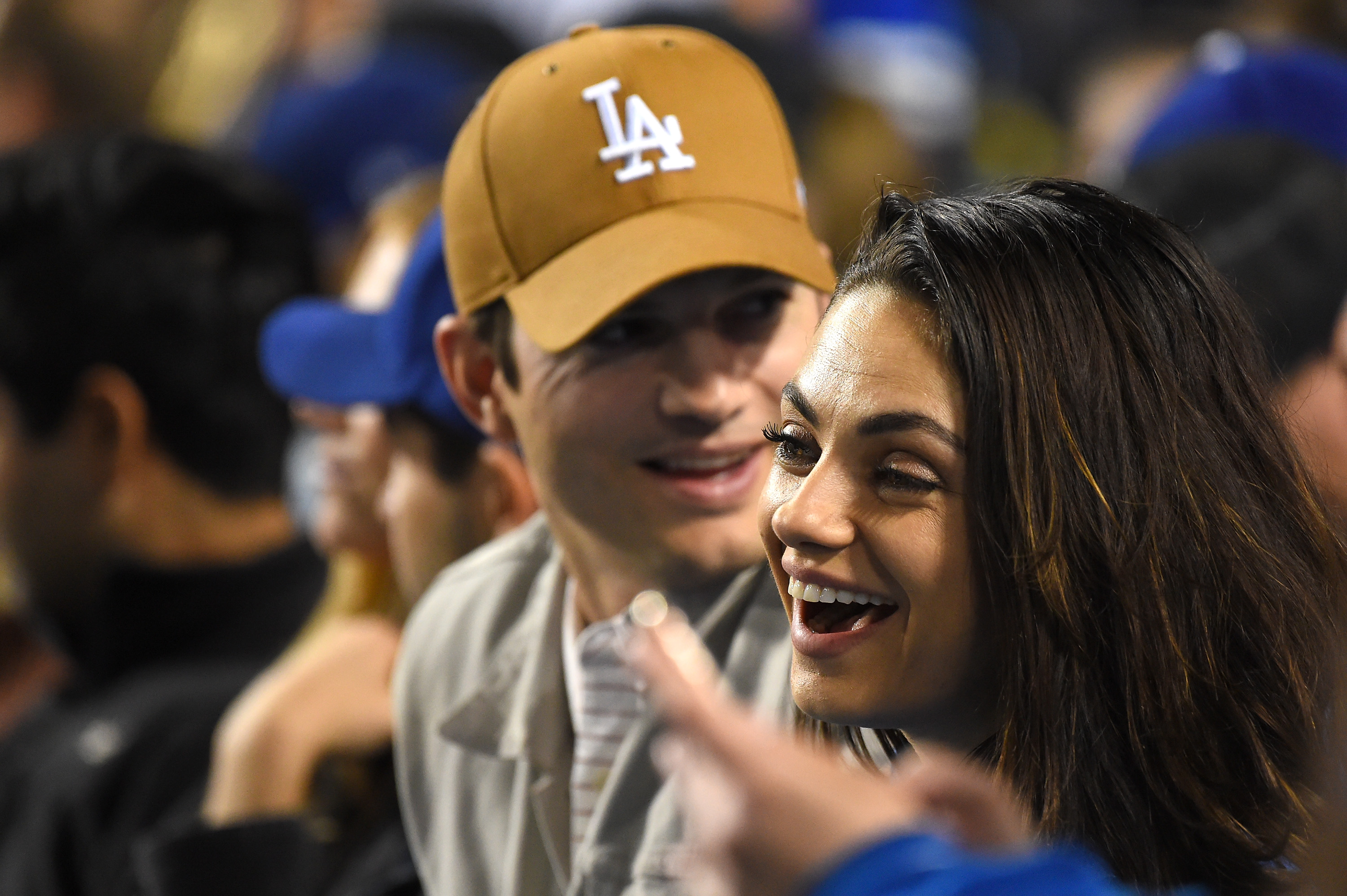 Ashton Kutcher and Mila Kunis at the game between the Los Angeles Dodgers and the Oakland Athletics at Dodger Stadium on April 11, 2018, in Los Angeles, California. | Source: Getty Images