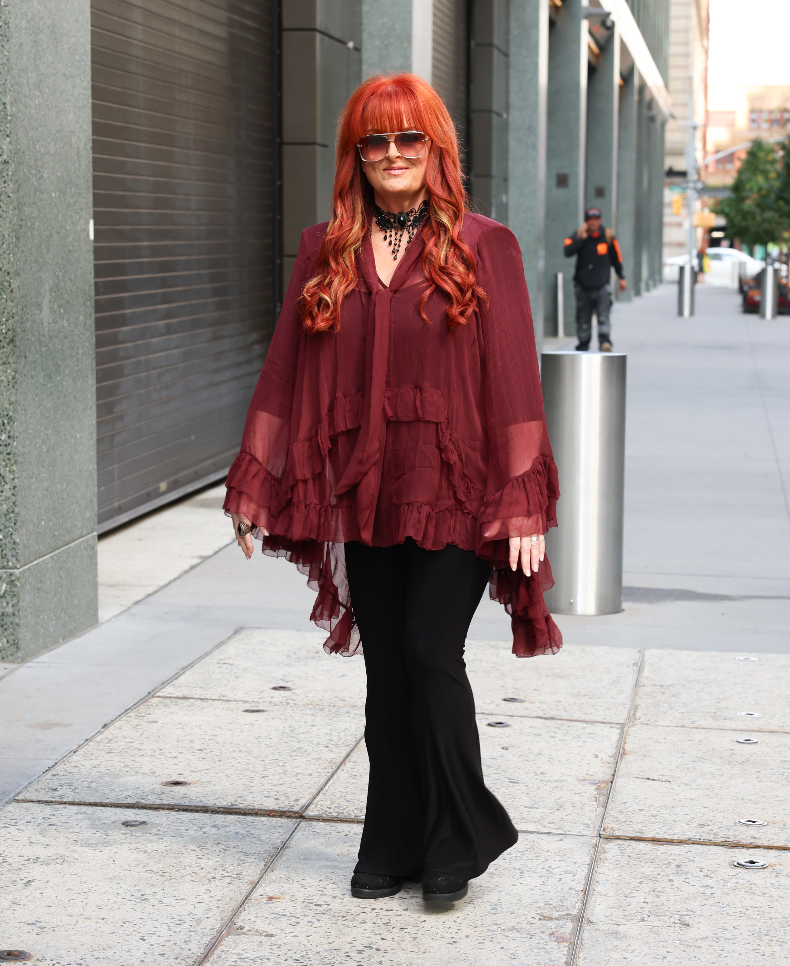 A second photo from the same October 5 outing showed Wynonna's complete ensemble as she walked outside the studio. The full-length view also provided a clearer look at her slimmer figure, adding another point of comparison with photos from earlier in her weight-loss journey.