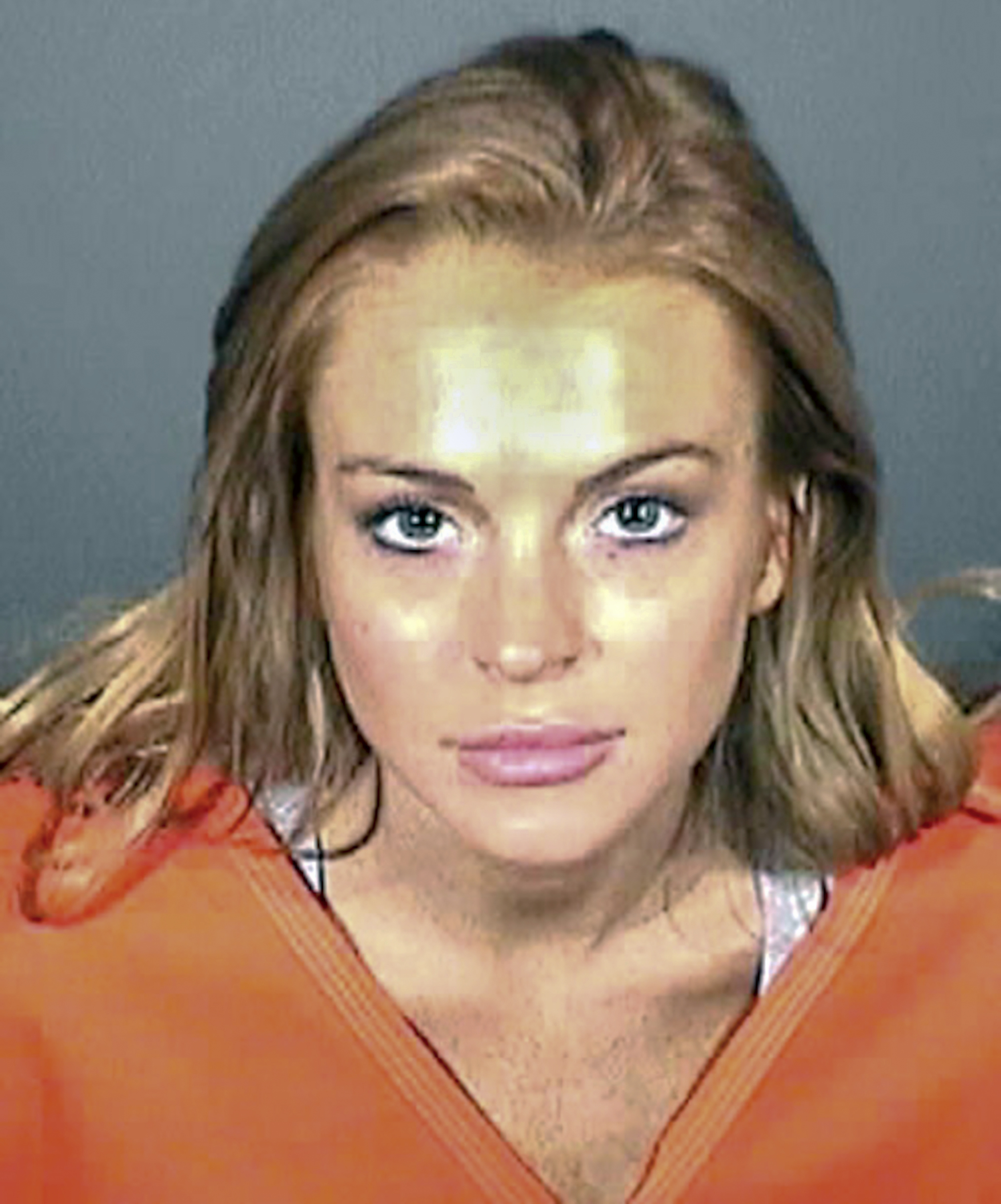 Lindsay Lohan posing for another mugshot in Los Angeles, California in September 2010. | Source: Getty Images
