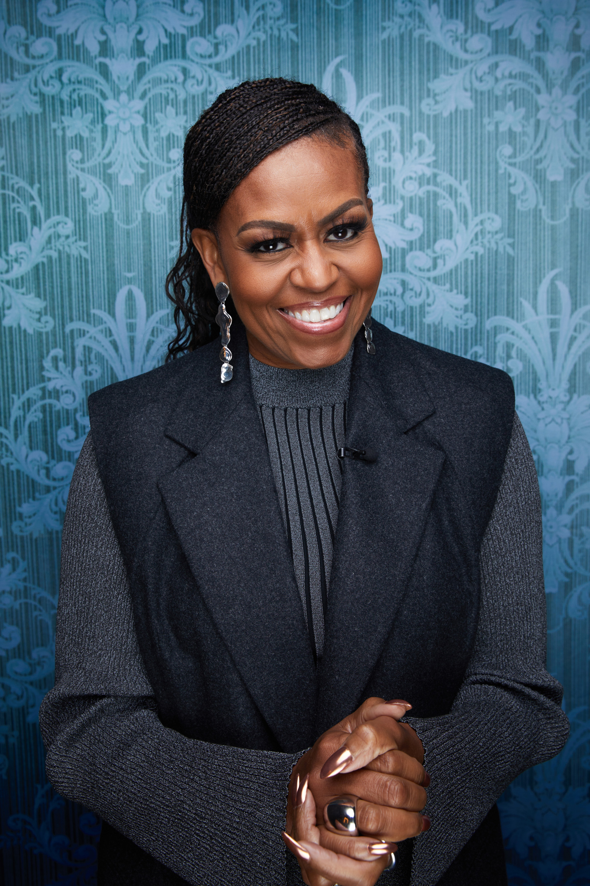 The contrast became clearer after the White House, when Michelle could begin wearing braids without the same political calculation attached to them. What once felt potentially controversial could now simply become part of her personal style. | Source: Getty Images