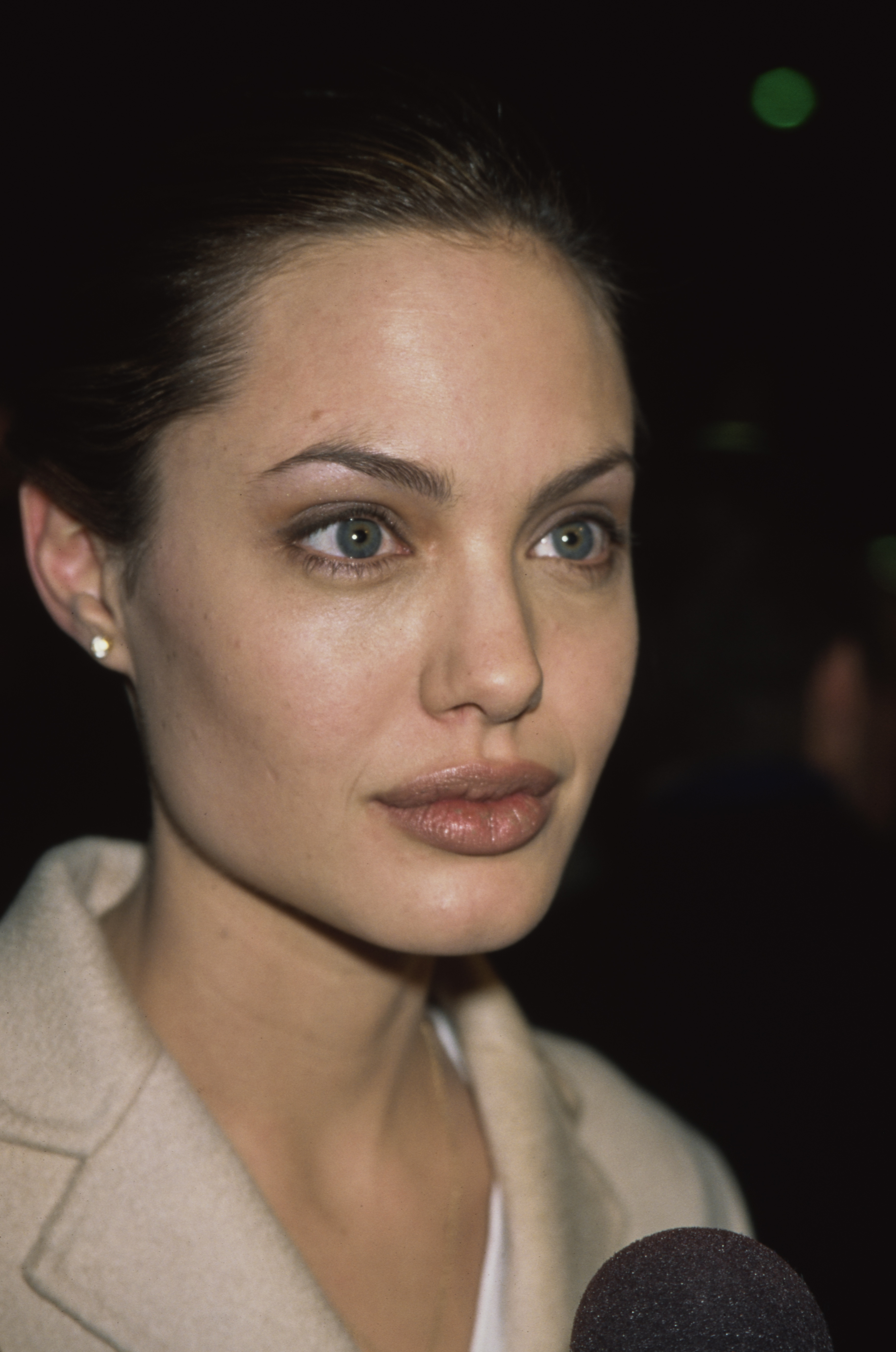 Jolie's rise to international fame brought increasing attention to her facial features, which became part of her signature Hollywood image. Decades later, those same features would become the subject of renewed online scrutiny.