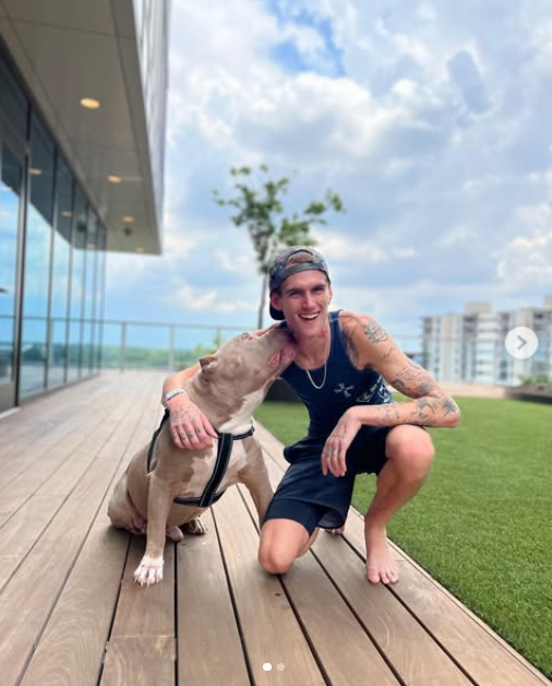 Presley Gerber shared a heartwarming moment outdoors with his dog, flashing a wide smile on a wooden deck as his pup gave him an affectionate nuzzle on the neck in a post shared on June 28, 2022. | Source: Instagram/presleygerber