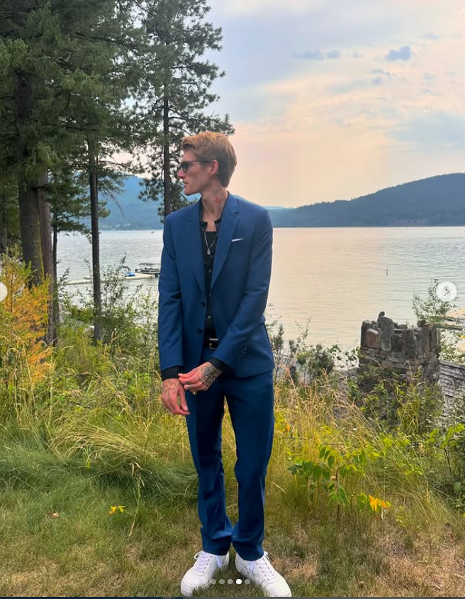 Presley Gerber poses in a blue suit during a 2024 lakeside getaway, showing a more personal side of the model away from the runway and fashion events. | Source: Instagram/presleygerber