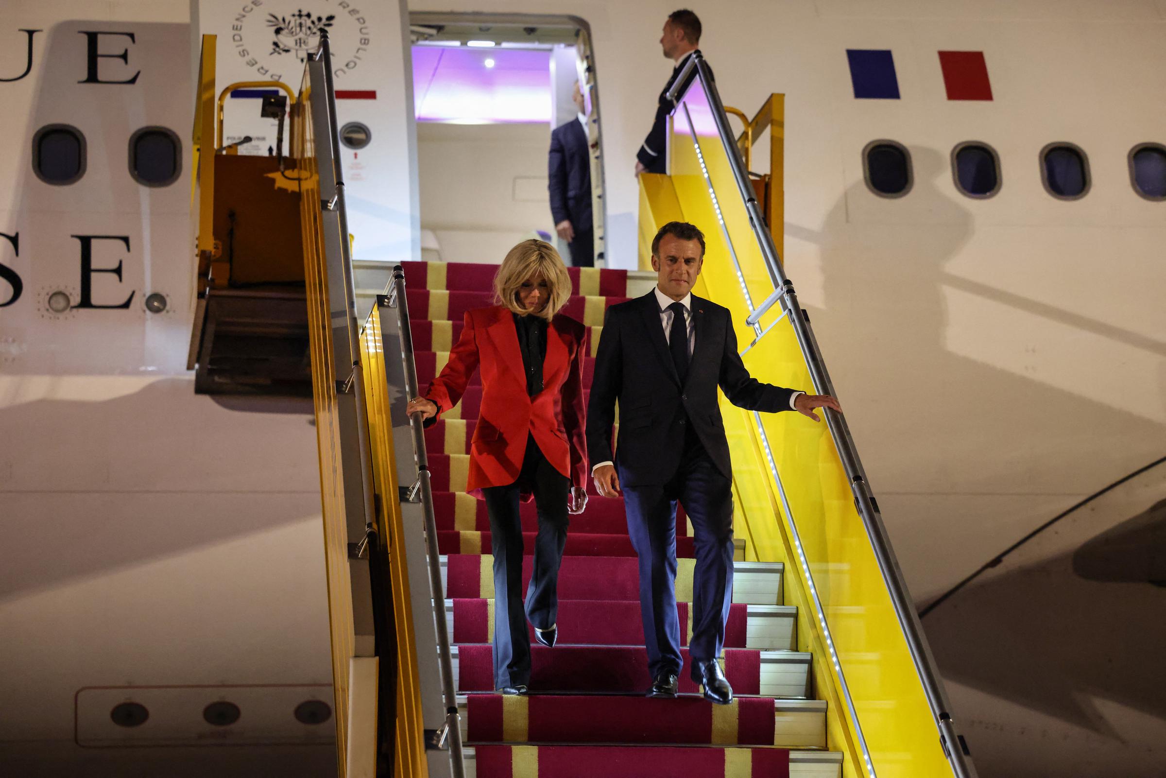 Brigitte Macron and French President Emmanuel Macron disembarking from their plane in Hanoi, Vietnam on May 25, 2025. | Source: Getty Images