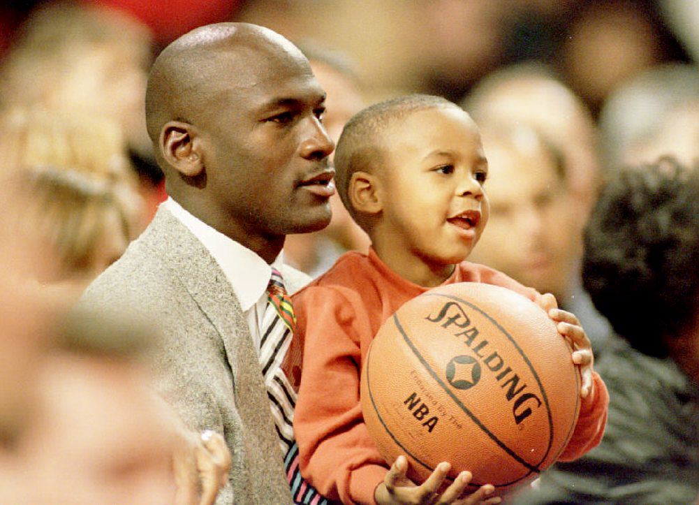 Michael and Marcus Jordan watching a basketball game on November 6, 1993. | Source: Getty Images