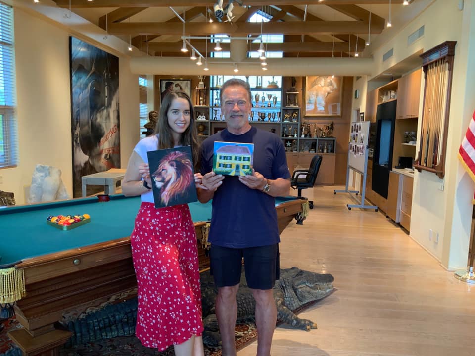 Arnold Schwarzenegger poses with a guest in a photo posted on July 23, 2021 | Source: Facebook/arnold