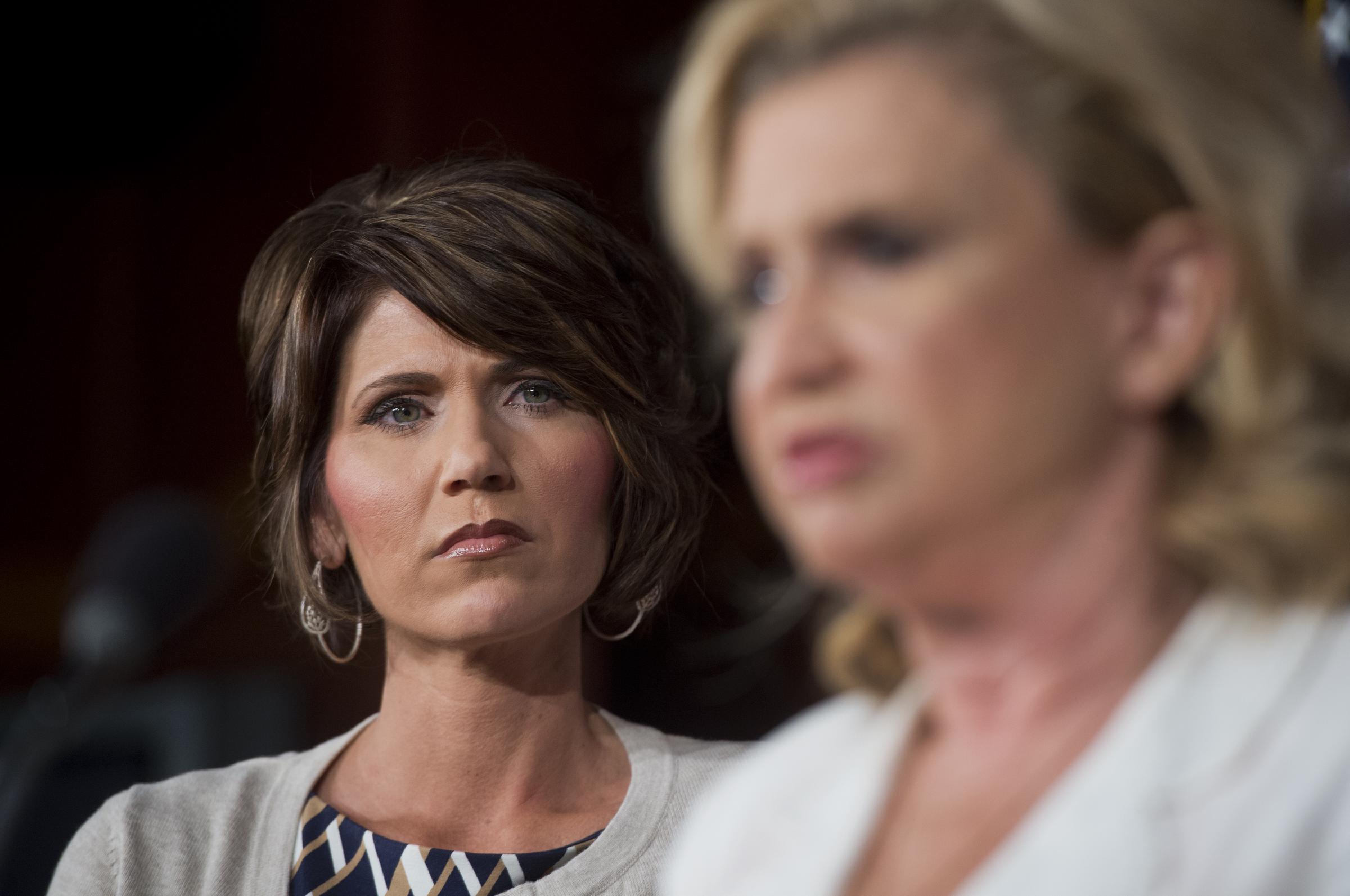 Kristi Noem and Carolyn Maloney conduct a news conference in the Capitol on legislation to reduce human trafficking on August 1, 2013, in Washington, D.C. | Source: Getty Images