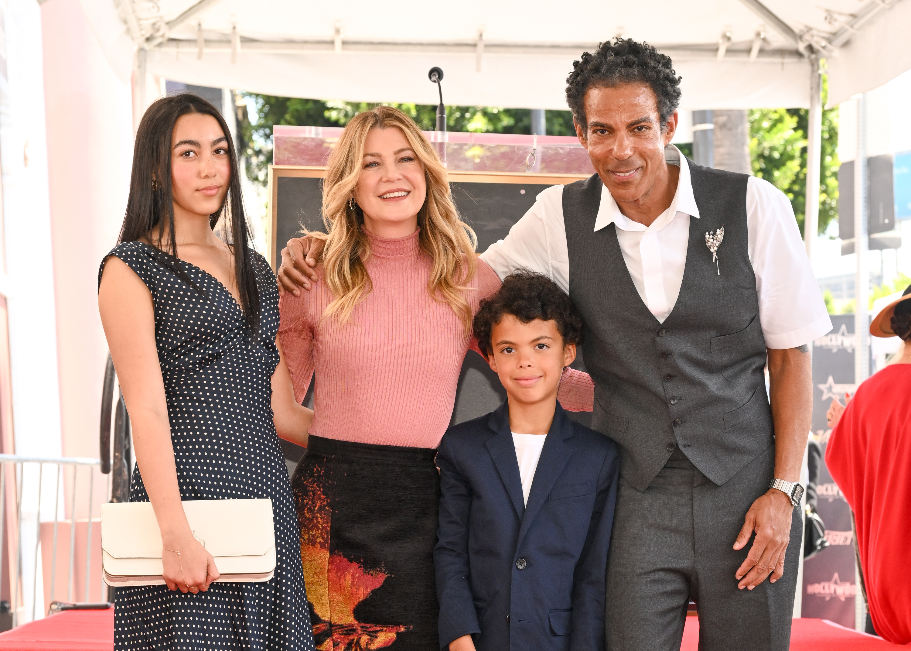(L-R) Stella, Ellen Pompeo, the couple's son, and Chris Ivery pose at the ceremony honoring Ellen Pompeo with a Star on the Hollywood Walk of Fame on April 29, 2025, in Hollywood, California. | Source: Getty Images