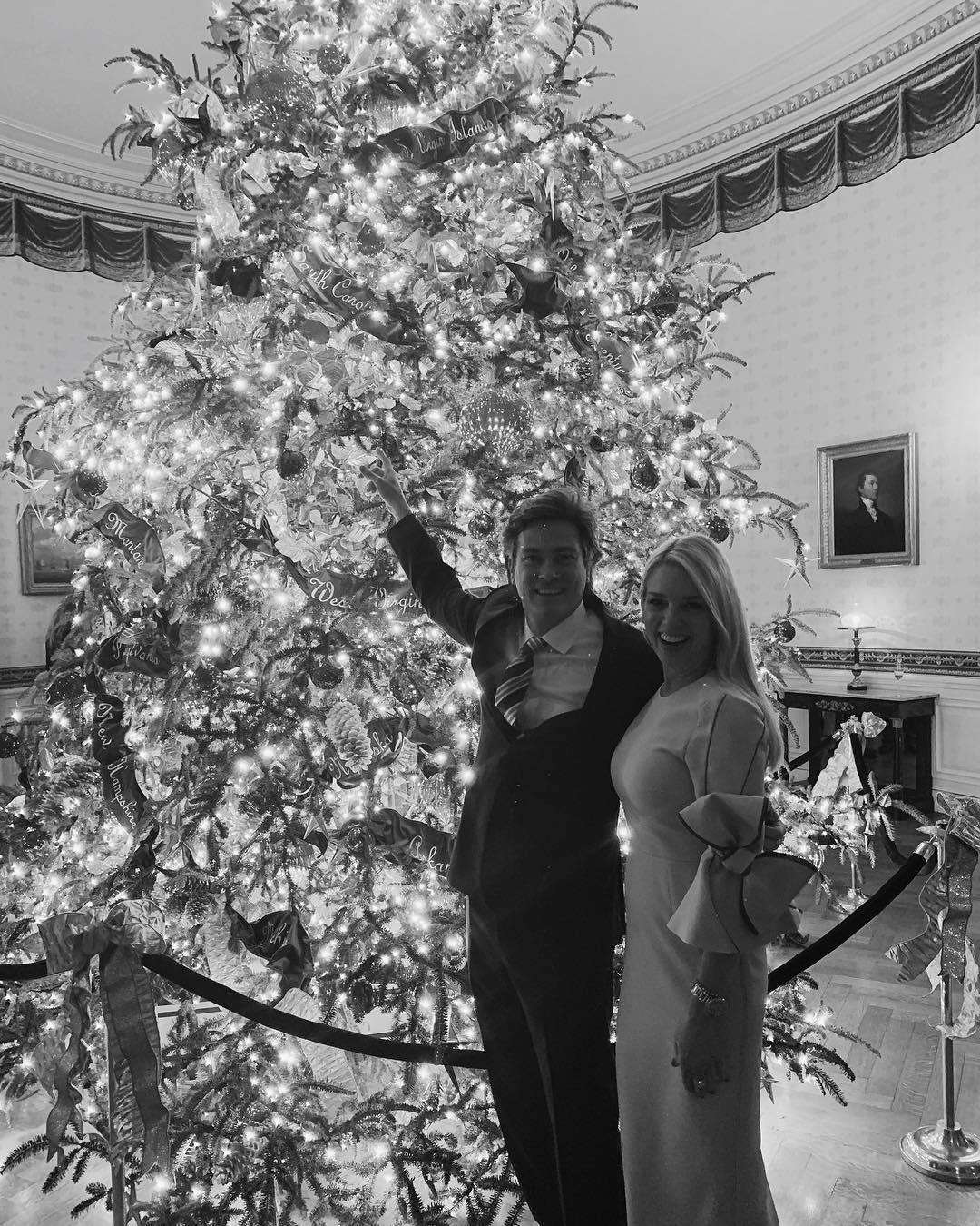 Pam Bondi and John Wakefield stand beside a decorated Christmas tree at the White House | Source: Instagram.com/pambondi