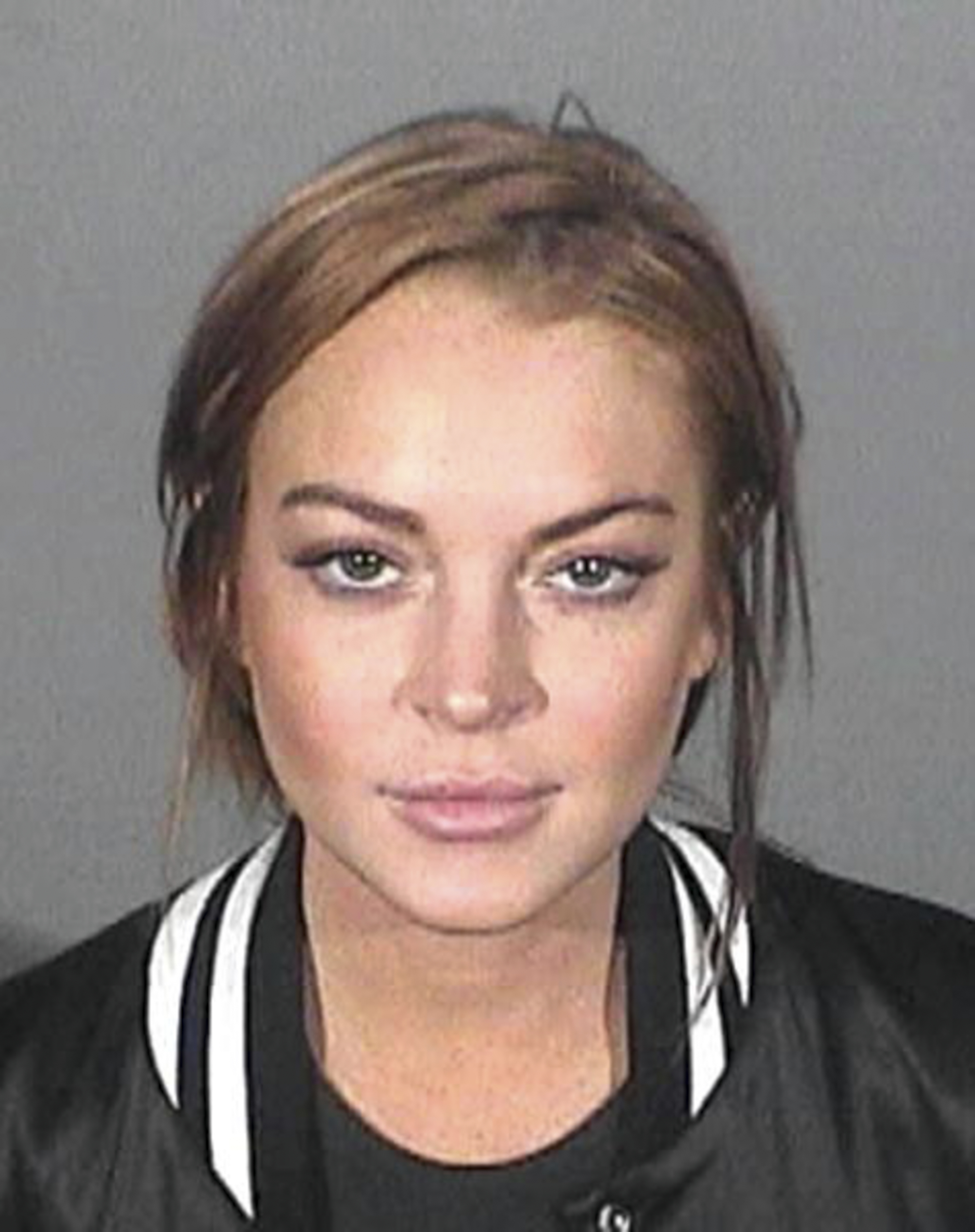 Lindsay Lohan poses for a mugshot following her arrest in Santa Monica, California in March 2013. | Source: Getty Images
