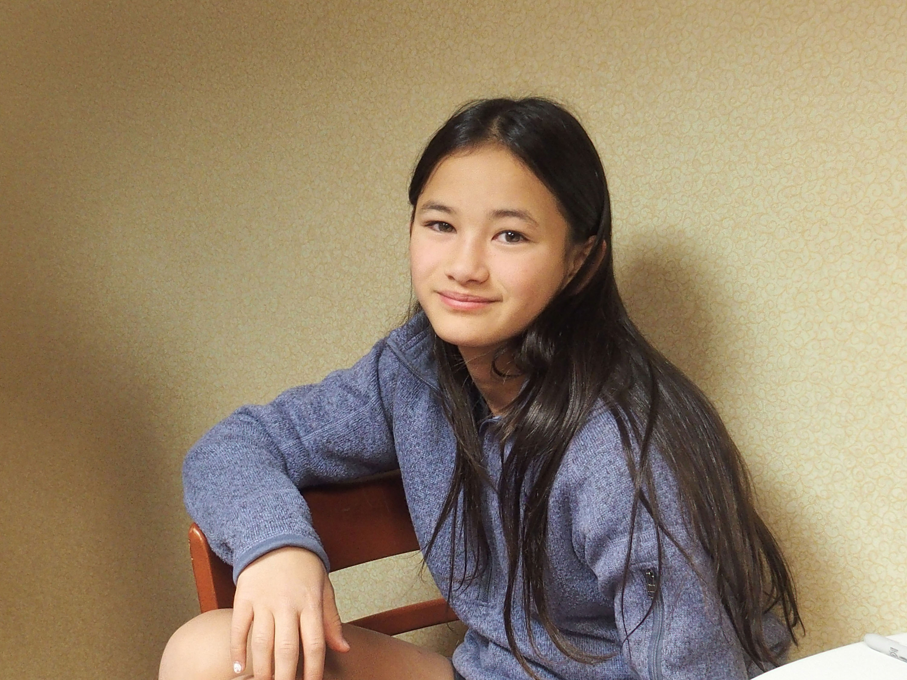Kaylee Hottle smiles for a portrait at the 2021 Northeast Comic Con & Collectibles Extravaganza in Boxborough, Massachusetts, connecting with fans following her breakout role in "Godzilla vs. Kong." | Source: Getty Images