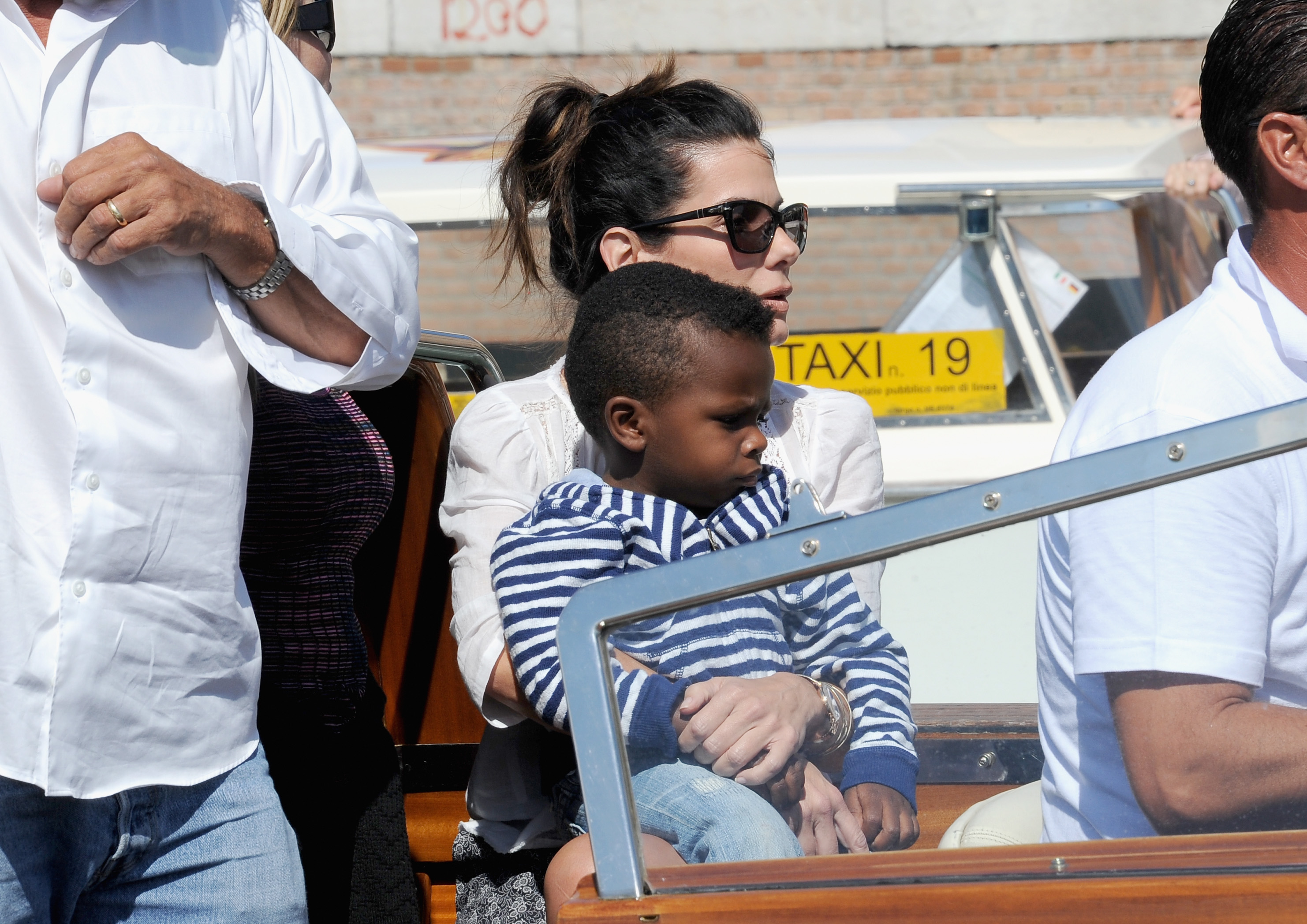 Sandra Bullock embraced added responsibility as she navigated raising her growing family in the public eye. During this outing, she and her son Louis Bardo Bullock attended the 70th International Film Festival on August 27, 2013, in Venice, Italy. | Source: Getty Images