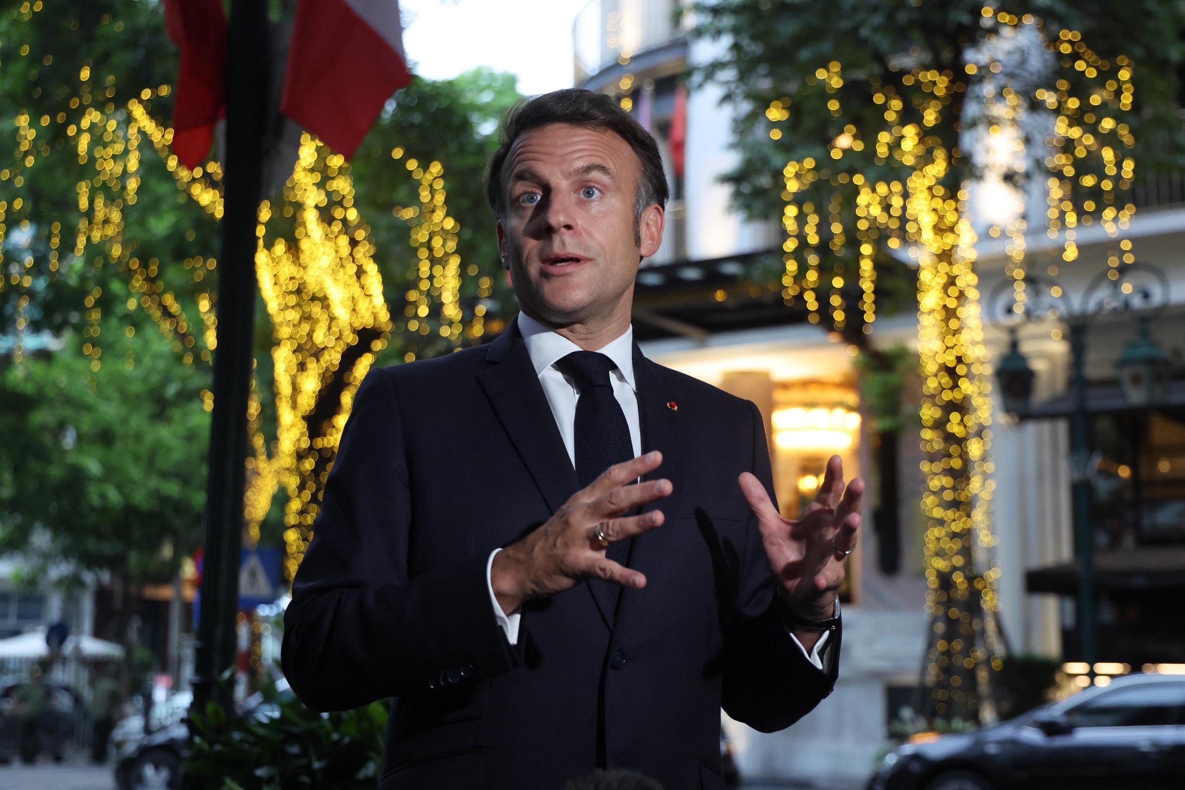 Emmanuel Macron addressing reporters. | Source: Getty Images