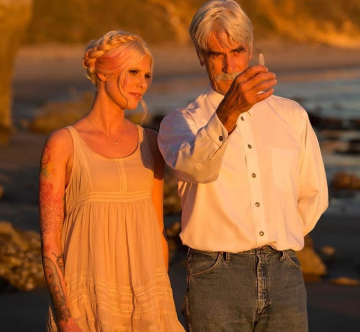Golden-hour sunlight illuminated a serene beach outing between Cleo Rose Elliott and her father, Sam Elliott, in a post shared on November 5, 2024. The pair took time to examine coastal treasures as Sam held a small, crystal-like stone up to the fading light in a white long-sleeve button-down shirt and classic blue jeans. Standing right by his side, Cleo looked on in a sleeveless cream sundress, finishing the seaside moment with an intricate braided crown woven with subtle pink tones.