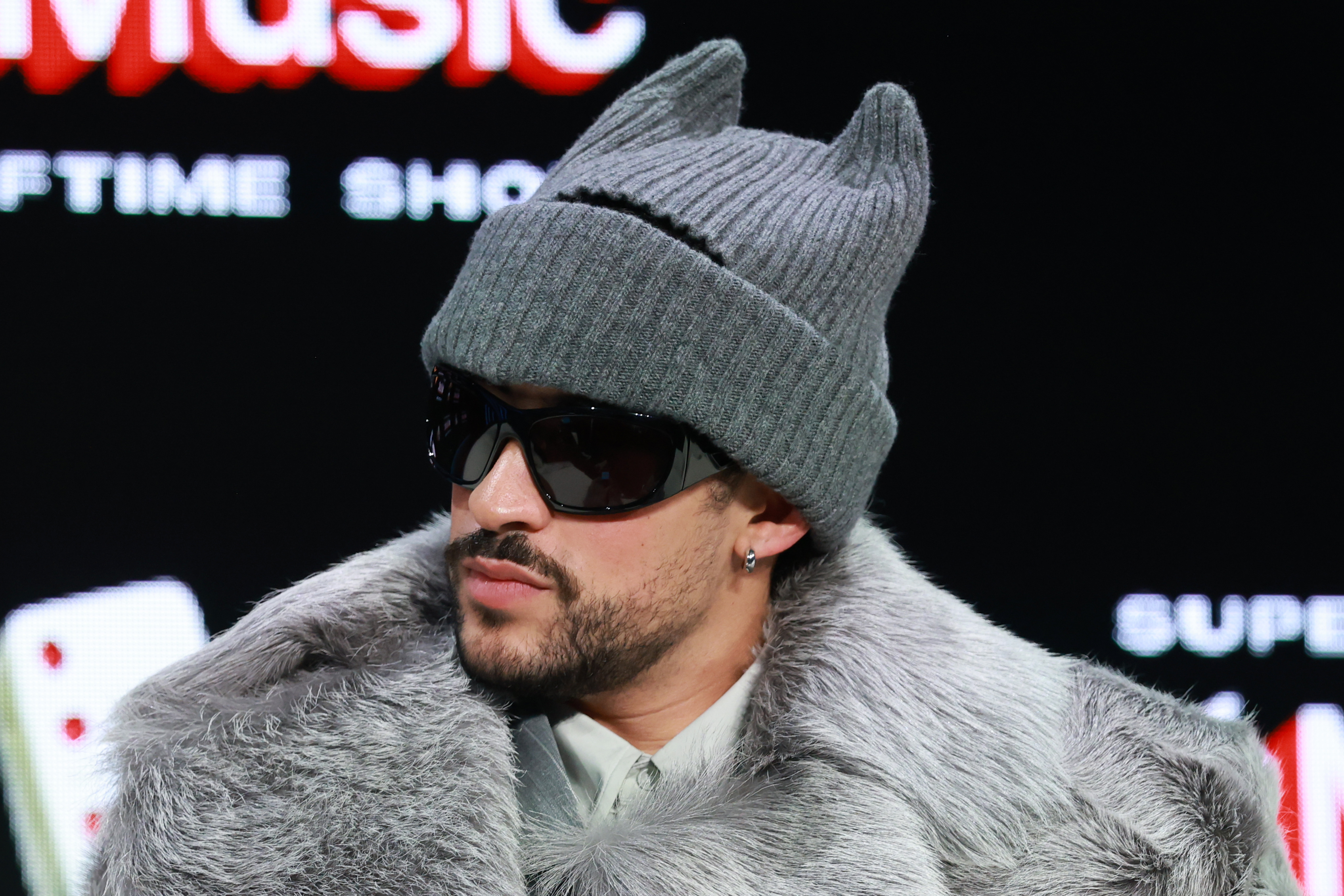Bad Bunny onstage during the Super Bowl LX Pregame & Apple Music Super Bowl LX Halftime Show Press Conference in San Francisco, California on February 5, 2026. | Source: Getty Images
