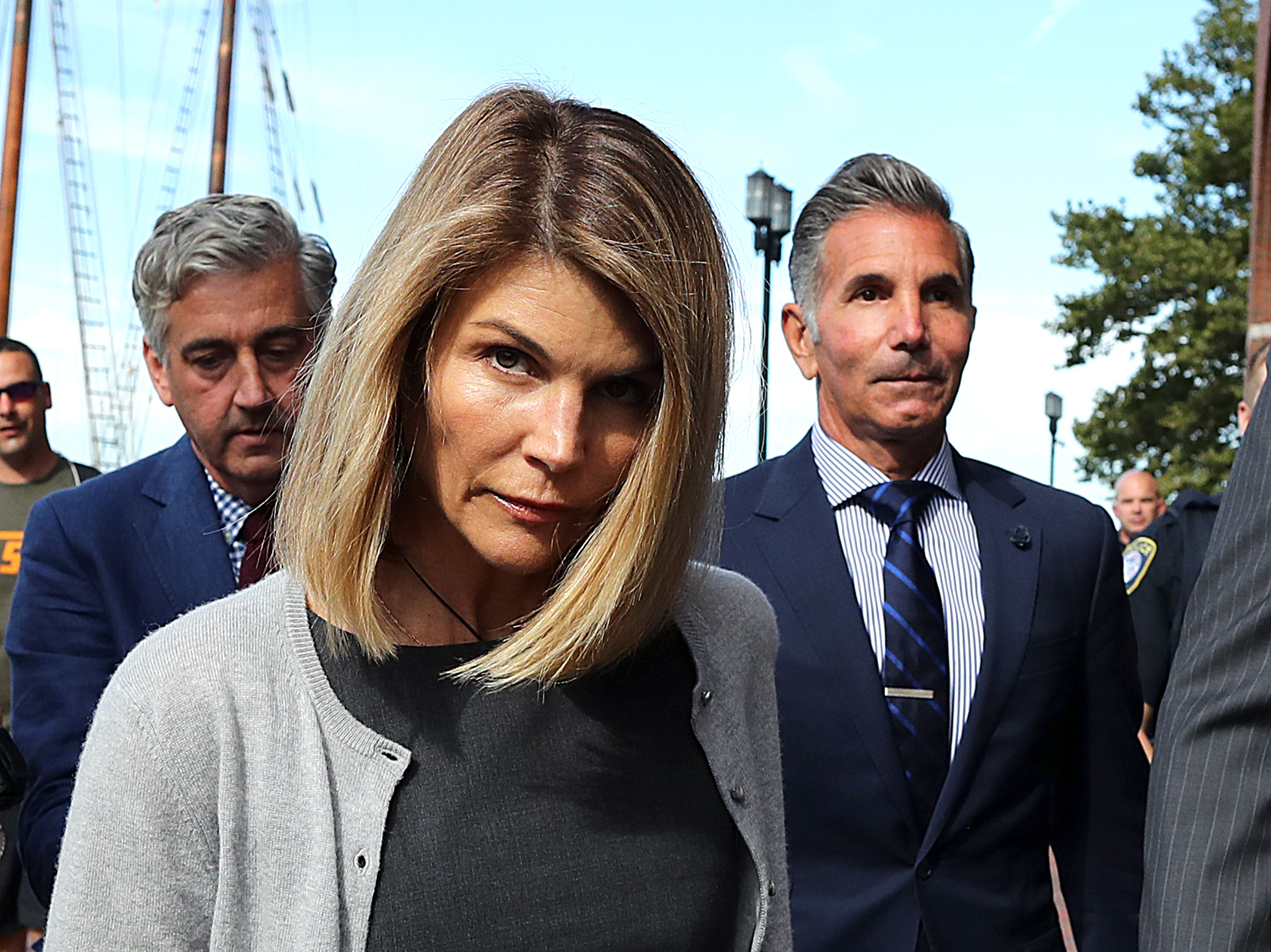 Loughlin and Giannulli leave the John Joseph Moakley U.S. Courthouse in Boston on August 27, 2019. Their court appearances put the couple at the center of a legal case that would eventually result in guilty pleas and prison sentences. | Source: Getty Images