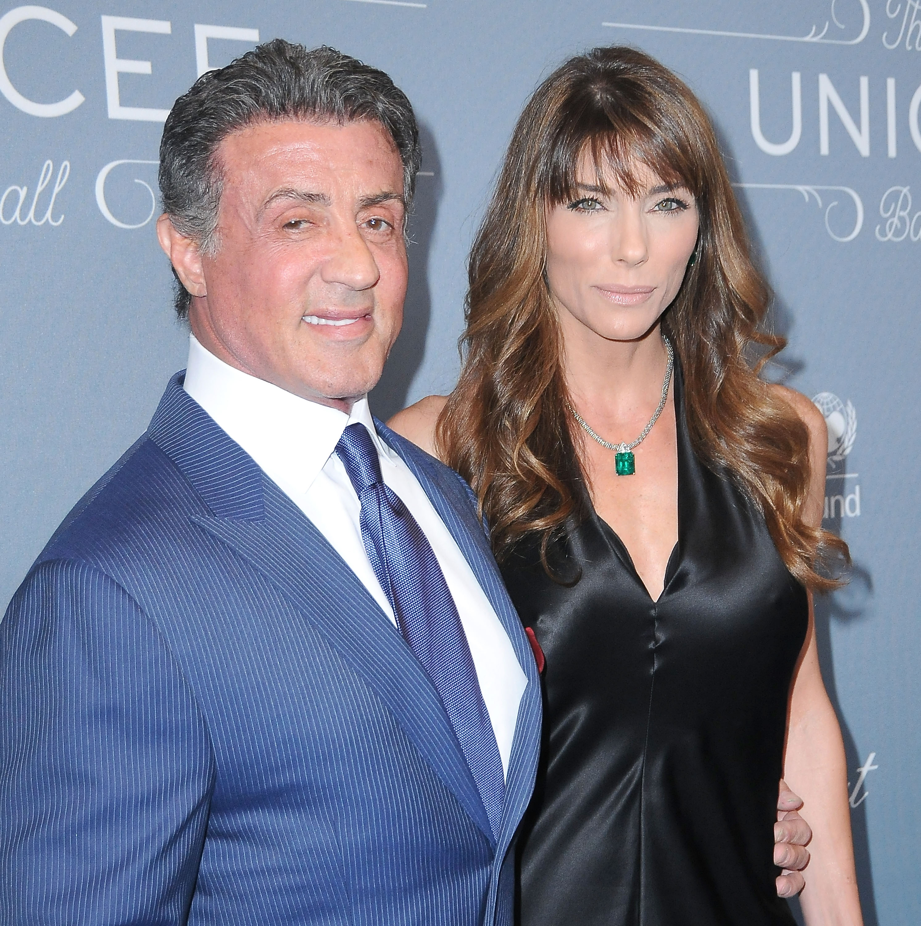 Sylvester Stallone and Jennifer Flavin arrived for the 2014 UNICEF Ball presented by Baccarat at the Regent Beverly Wilshire Hotel in Beverly Hills, California, on January 14, 2014. Stallone sported a blue pinstripe suit, while Flavin complemented him in a black satin dress with an emerald pendant. Their appearance came nearly 17 years after exchanging vows, with the spouses raising three daughters, Sophia, Sistine, and Scarlet, during their marriage.